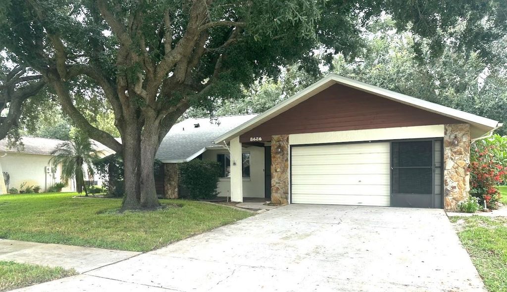 Photo of 8626 Woodbridge Drive, New Port Richey, FL 34655 (MLS # TB8395447)