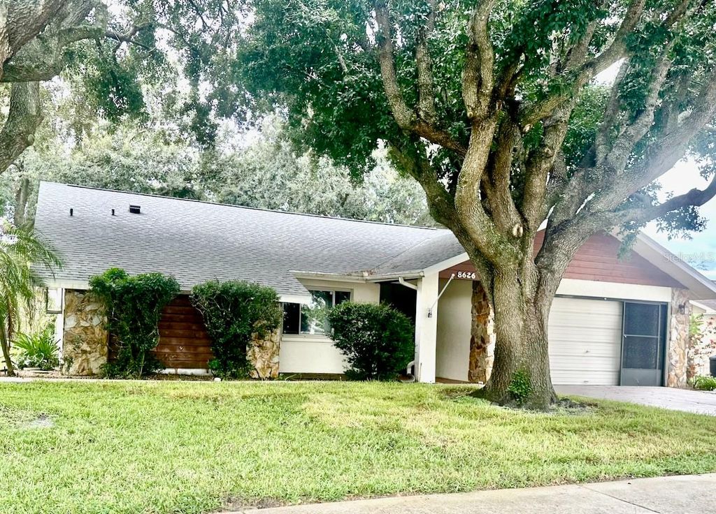 Photo of 8626 Woodbridge Drive, New Port Richey, FL 34655 (MLS # TB8395447)