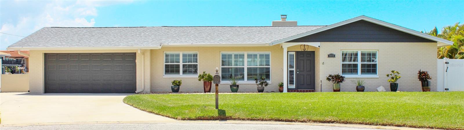 Beautifully remodeled 3-bedroom 2-bath home on an extra wide lot featuring 158 feet of newer seawall waterfront! A boating & fishing dream home! 2 newer composite material docks with fob controlled lifts (13,000 lb. and 10,000 lb), a jet ski lift and wet slip with room for a large sailboat. Beautiful landscaping, stonework and pavers create a fantastic outdoor experience and extended living space.
This home has been COMPLETELY renovated and refreshed top to bottom: New Heated or cooled pool and spa with upgraded Hayward Omni Logic Pool system with an App so you can program the pool settings, heat the spa, change the timers and LED lighting from your phone or computer. Upgraded PebbleTec pool coating . Generous 6x9 storage room has a large safe to be included with sale.
NEW roof, NEW flooring, NEW PEC water lines throughout, NEW air conditioner & 2 mini split systems (sunroom & garage), NEW remodeled bathrooms, NEW kitchen, NEW sunroom and NEW gorgeous outdoor lanai and kitchen.
This is a must see home in sought after Gulf Harbors, DON'T MISS THIS ONE!