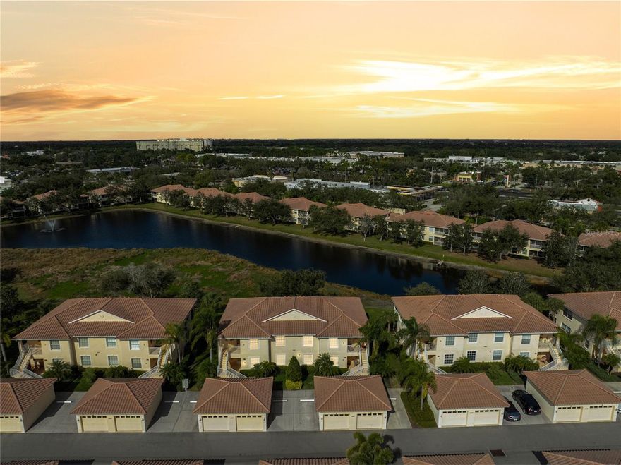 Wake up to shimmering pond views, mature trees, and the gentle rhythm of nature in this light-filled, corner residence tucked inside the highly sought-after Venetia community of Venice. Framed by lush landscaping, abundant birdlife, and even the occasional bobcat sighting, this home offers a peaceful setting with a glorious water view that feels like a private retreat. A welcoming front sitting area creates the perfect spot for morning coffee or evening conversations, where screened and storm-protected entry doors invite fresh air and cooler breezes to flow easily through the home. With lanai sliders open, enjoy effortless front-to-back airflow that enhances the home’s open, airy feel. The screened lanai is tiled, creating a clean, comfortable outdoor extension ideal for relaxing and enjoying the view. Inside, high ceilings and plantation shutters throughout complement the abundance of natural light this corner location provides. Ceramic tile flows through the main living areas, while the bedrooms feature well-maintained carpet in excellent condition. Closet organizers add everyday functionality, and impact-rated windows designed to withstand up to 250 MPH winds provide peace of mind. The kitchen features a convenient breakfast bar along with an open, flexible dining space that comfortably accommodates a table for four, creating a natural transition into the main living area. Thoughtful upgrades include a tile backsplash, pantry with linen shelving, pull-out cabinetry, and under-counter lighting. Just beyond, the living room offers a built-in buffet that can be used for serving, storage, or styled as a dry bar—ideal for entertaining or everyday living. Sliding doors lead back to the tiled, screened lanai with a blackout shade for comfort and privacy while overlooking serene pond views and mature greenery. The laundry room is generously sized and upgraded with a deep-well utility sink, cabinetry, shelving, refrigerator, multiple windows for natural light, and a dedicated folding area—making it both functional and well organized. Venetia is known for its friendly neighbors, active lifestyle, and resort-style amenities, including a heated community pool, specific pool for Casa di Amici, hot tub, clubhouse, fitness center, tennis, bocce and pickleball courts, and scenic walking trails. Shopping and restaurants are conveniently located along with Venice’s beaches, historic downtown, and everyday conveniences are just minutes away. This is Florida living at its finest—peaceful, connected, and perfectly positioned. ¤ Please see 3D Tour and Video ¤