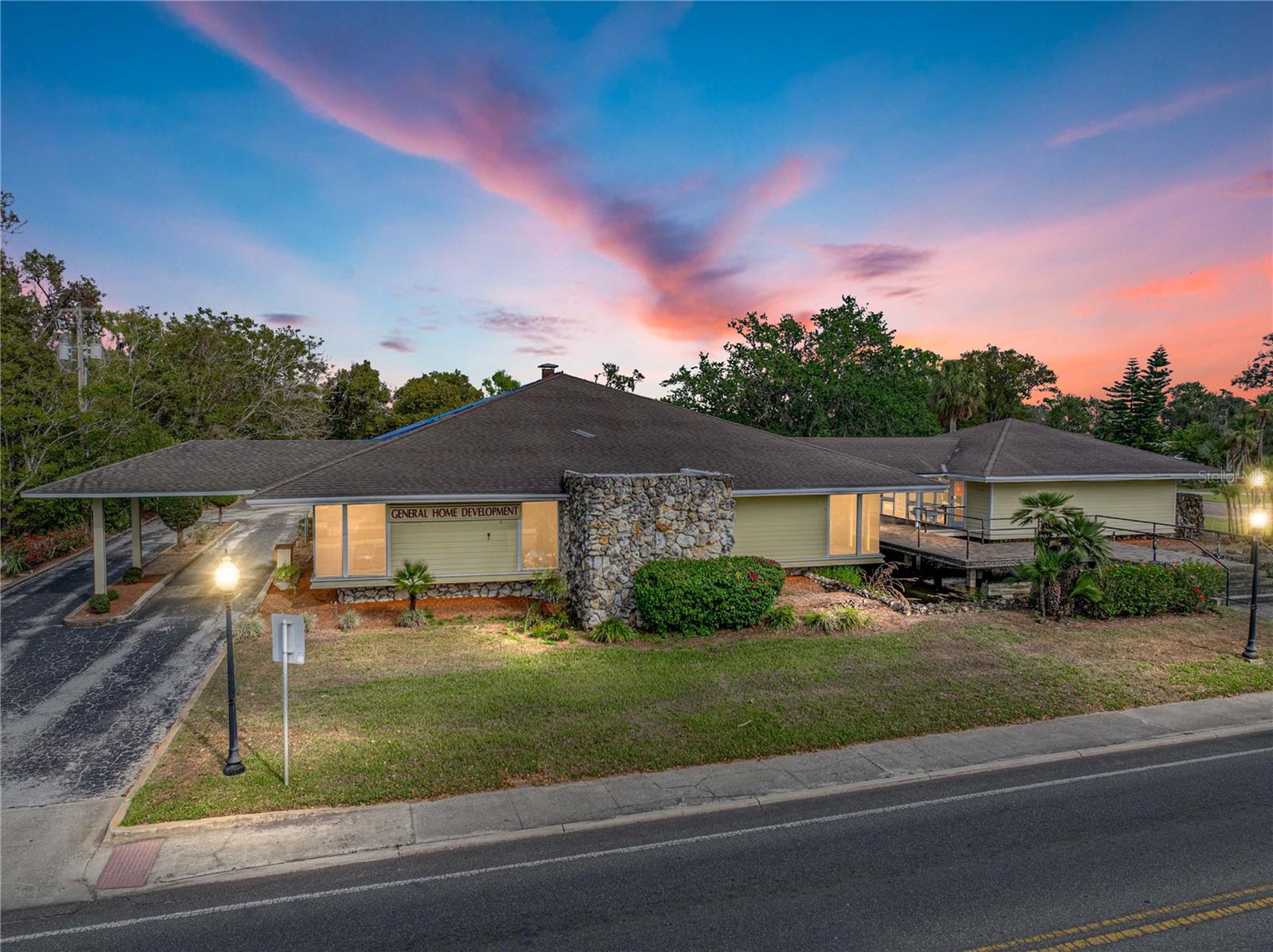 Seize the opportunity to establish your business in a highly visible, high-traffic location, with
200ft of 7th Street road frontage in the heart of Dade City. This prime corner-lot commercial
building, zoned RIO, has 2 separate office buildings, totaling 4,534 sq ft, connected by a
common canopy offering exceptional accessibility, ample on-site parking with 50 spaces, and
a layout designed to accommodate a wide range of uses. In the first 3,424 sq ft building, the
welcoming lobby sets the tone for a professional and inviting atmosphere inside. A dedicated
conference area, 6 private offices, a break room with a kitchen, his and hers bathrooms, and
generous storage rooms provide the functionality and flexibility needed for an efficient
workspace. Adding to its unique appeal, the building retains its original bank vault- an amazing
feature that presents creative possibilities for secure storage or a distinctive design element.
The second 1,110 sq ft building features an open lobby/reception room, a private office, a full
kitchen, and 2 bathrooms. Positioned in a thriving business district with excellent visibility and
easy access, this property is ideal for offices, financial services, retail, and more. Don’t miss
this unparalleled opportunity to invest in a prime commercial asset in Dade City’s growing
market. Contact us today for more details on what RIO zoning will allow and to schedule a
private tour.