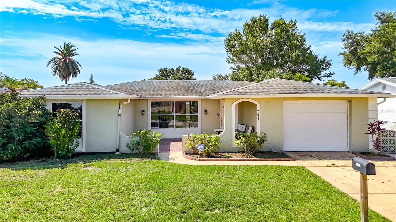 Welcome to this charming and spacious home, perfectly situated in the heart of Port Richey! This move-in-ready residence offers an ideal blend of comfort and convenience, making it a fantastic opportunity for any buyer. The moment you step inside, you'll be greeted by an inviting open-concept floor plan, which is filled with natural light. The generously sized living area flows seamlessly into the kitchen, which offers plenty of cabinet space and an eat-in kitchen perfect for casual dining. The home offers 3 bedrooms and 2 bathrooms, including a primary suite that serves as your private retreat. Step outside to your private oasis—an expansive screened-in lanai overlooking a beautiful fenced in backyard, ideal for outdoor gatherings, gardening, or simply relaxing in the Florida sun. Located in a highly desirable area, you are just minutes from the stunning Gulf of Mexico, where you can enjoy boating, fishing, and beautiful beaches. The home provides easy access to shopping, dining, parks, and major roadways for a simple commute to Tampa or Clearwater. Don't miss this opportunity to own a piece of the Florida lifestyle—schedule your private tour today! 2012 Roof, 2023 A/c, 2018 Water Heater. See 3D Virtual Tour 1 and 2