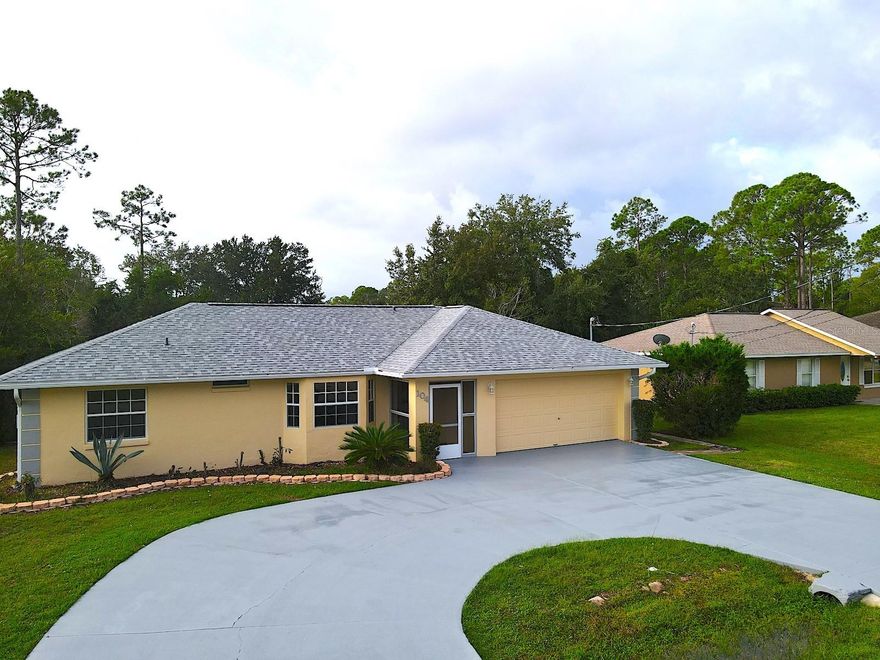 Cozy 3 Bedroom 2 Bathroom Home for Rent with Fully Fenced Yard and Circle Driveway in Lehigh Woods of Palm Coast. This home features 3 bedrooms, 2 baths, 2 car garage. Open floor plan, tile floors in main and wet areas and luxury vynil plank flooring in a bedrooms. The living area flows into the kitchen and dining area, with plenty of storage and cabinetry. Exit the living area to a Florida room complete with a window AC unit, and sliding doors to a spacious screened porch. The huge back yard is accessed via paver clad open patio, and is fully enclosed with a short wire fence. Enjoy lots of parking space with the huge circular driveway. Excellent location situates this home close to everything Palm Coast offers, including shopping, schools, entertainment, parks, Town Center, and more! Easy access to major roadways and the I95 offers a speedy commute to Jacksonville and Daytona, and a quick drive to the local Flagler Beaches. Inquire about it today! LBTR#13922
