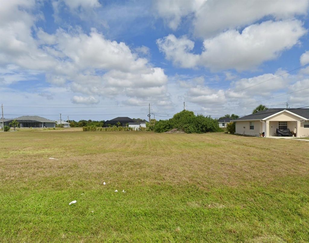 Photo of 303 Boundary Boulevard, Rotonda West, FL 33947 (MLS # N6142906)