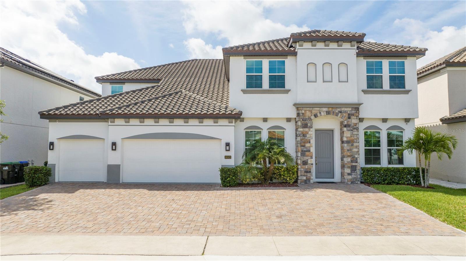 DONT MISS OUT!
Located within the gated Estate at Parkside community, this residence offers unparalleled luxury and convenient access to the vibrant Dr. Phillips Marketplace and renowned "Restaurant Row." With easy access to I-4 and Apopka Vineland Road, the best of Orlando is just moments away Luxury home, offering the luxury home offers spacious and well designed living spaces. This Spanish style 8-bedroom, 6 and half-bathroom home combines elegant design. This home provides generous living space, allowing for both privacy and gatherings with family and friends.
With an oversized 3-car garage. Step into elegance as you enter the formal dining room, leading to the spacious family room, and eat-in kitchen with island sink and bar. The first-floor owner's suite offers a private sitting room, spa-like bath, and ample closet space. An additional bedroom and full bathroom grace the first floor. Moving to the second floor entertainment lover's dream, there's a loft/lounge with bar, big living room, and home theater, and additional 5 bedrooms and full bathroom, Step out to the lanai for relaxation or BBQ parties by the sparkling pool and summer kitchen.
