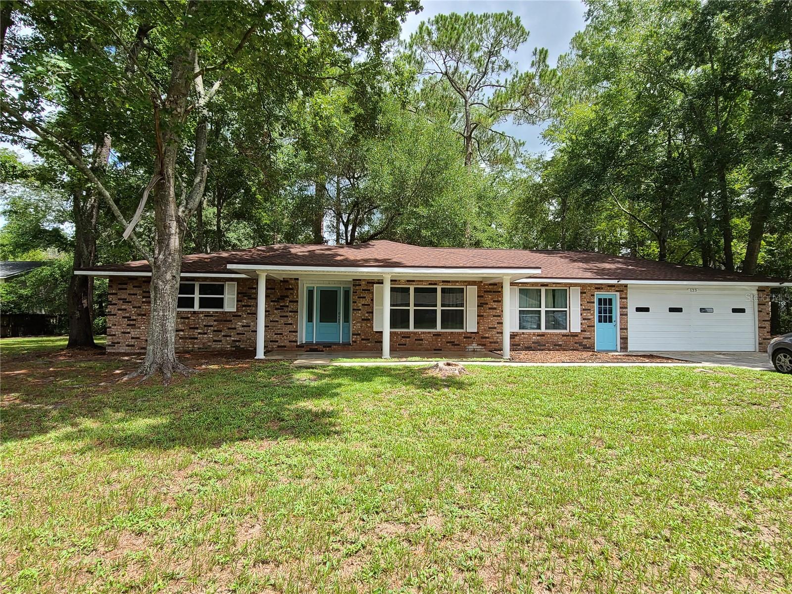 2,800+ Square foot house, on corner Lot nearly 1 acre! This is a large, 3 bedroom two bath with an additional living area of approximately 1,000 sq. feet added in the last 10 years. Brand new roof, new AC, well recently replaced, newer windows and sliding glass doors, new ceiling fans and light fixtures. Vinyl plank flooring throughout (2018). The septic tank was pumped in 2025. Beautiful pine tree lots. Typical north Florida /Southern Georgia charm. Motivated sellers. Come see it while it lasts. Currently owner occupied so notice is required for showings. Appointment only.