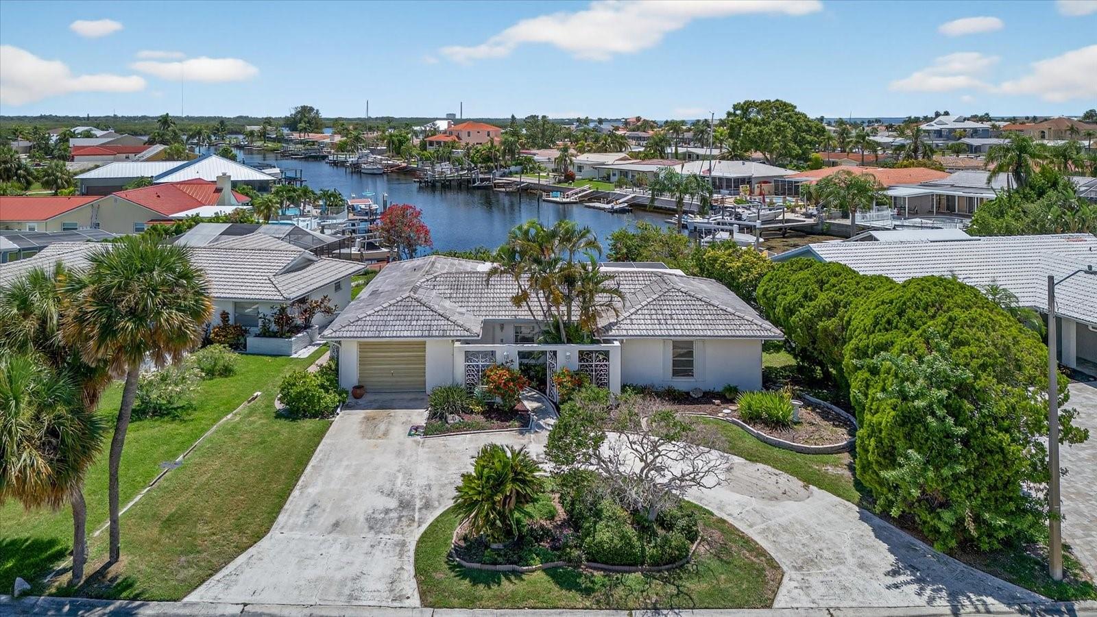 Diamond in the rough alert! This Gulf Harbors home is ready for your vision.
Located in one of New Port Richey’s most desirable Gulf Front communities, 3818 Topsail Trail is a 2-bedroom, 2-bath block home full of potential and ready for renovation. Whether you’re a seasoned investor looking for your next flip or a buyer hoping to design a personalized primary or vacation home, at a fraction of the cost this property offers the ideal canvas to build equity and create value to start living your life by the water today.
The layout is spacious and functional, with great bones, a tile roof, working electrical and plumbing, and the flexibility to be reimagined to suit your vision. The property sits in Gulf Harbors, a well-established waterfront neighborhood known for its laid-back lifestyle, great deep water boating access, and optional amenities—including a private beach club (only $200 A YEAR) , community boat ramps, and a low optional HOA fee of just $125 a year. The yard is very spacious sitting on almost a 1/4 acre with over 50ft of seawall with easy access to the south channel.
You’ll enjoy a prime location just minutes from shopping, restaurants, downtown New Port Richey, and direct access to the Gulf for endless recreational possibilities. With very few homes of this caliber available, here's your shot to own a slice of paradise and make it whatever you desire. Ask how you can get approved for a renovation loan, or use hard money to get in this home today!