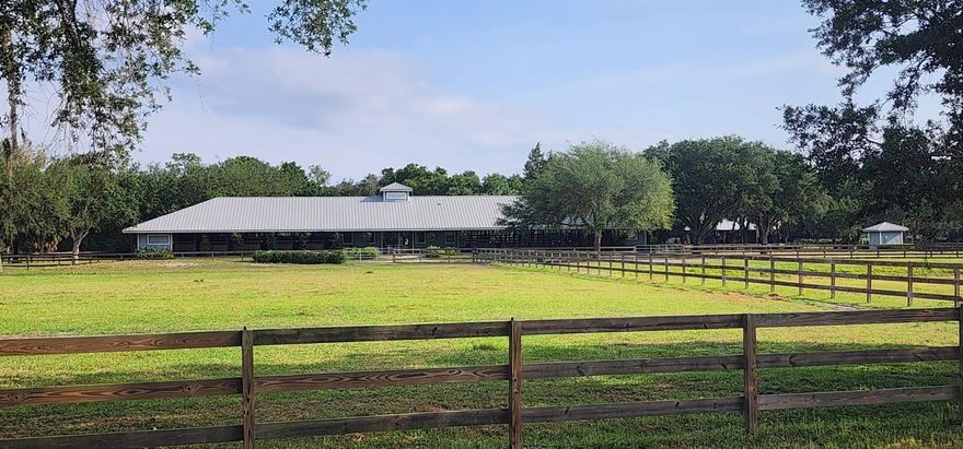 Under contract-accepting backup offers. Nestled within the prestigious SARASOTA POLO CLUB, this sprawling 11.26-acre equestrian estate offers a unique chance to craft your dream residence surrounded by equine excellence. The property boasts a comprehensive 20-stall barn complemented by a tack room and a cozy studio apartment, all encircled by verdant paddocks. Adjacent to the main barn, discover an additional 8-stall barn featuring a spacious 2 bedroom, 2 bathroom apartment—perfect for guests or as a rental. MORE PHOTOS COMING THIS WEEK.

Both barns provide ample space for parking trailers or boats, enhancing their practical appeal. The existing stall and groom accommodations present lucrative income possibilities during the polo season, making this more than just a home but an investment.

Located just steps from the acclaimed Out-Of-Door Academy and within a mile of top-notch restaurants, grocery stores, and shopping venues, this property promises a lifestyle of convenience and luxury. Take your Golf Cart to the new town center of Waterside to enjoy the Farmer's Market, Food Truck Wednesday and so much more! Don’t miss out on owning a slice of paradise with all conveniences at your fingertips. A truly exceptional offering that blends lifestyle and opportunity seamlessly.