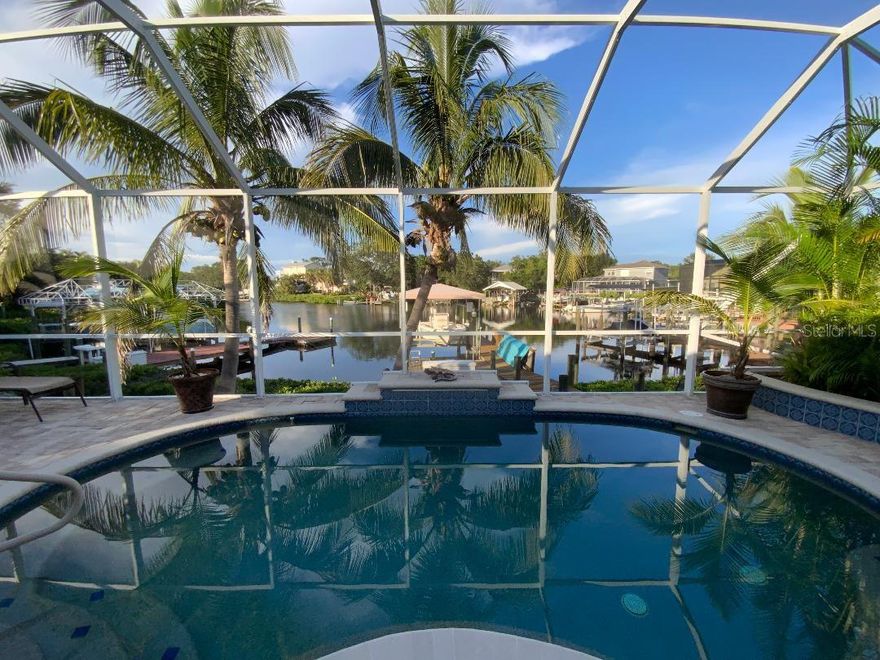 PRICE REDUCTION for this Waterfront Paradise with Direct Gulf Access. Welcome to your dream home in the sought-after River Pointe community, where boating, entertaining, and luxury living come together. The original owner's pride of ownership prevails in this beautifully updated 3-bedroom, 2-bath residence.  The home sits on a wide saltwater canal at the end of a tranquil basin—offering privacy, minimal boat traffic, stunning views of dolphins dancing, manatees floating, mullet jumping, AND easy navigation to the open waters of the Manatee River, Intercoastal Waterway, and Gulf.  The property is a Boater’s Dream, complete with dock, a covered lift that accommodates boats up to 28 ft and 9,000-pounds, and a floating dock. Features include a well-built and modern home.  This personality plus home offers a spacious 3-car garage for vehicles, gear, and storage; high ceilings, split floor plan, new roof (2020) for peace of mind, remodeled kitchen in 2021 with wood cabinetry, quartz countertops, and new appliances. Updated bathrooms (2021 & 2025) with modern finishes, new windows installed in 2022 and 2025 for energy efficiency and natural light and window hurricane screens.  YOUR Outdoor Oasis offers an inground pool with waterfall and 8 spa jets, screened lanai for year-round enjoyment, an expansive paver deck and covered entertaining area—perfect for gatherings, grilling, or relaxing poolside while enjoying the serene canal views to create a true Florida escape.  River Pointe residents enjoy low HOA fees and access to a private community boat ramp.  This home is the ideal blend of luxury, functionality, and waterfront lifestyle.  This property is located about two miles West of I-75 via SR 64, close to Costco, Publix, Target and Walmart, entertainment downtown Bradenton, River Walk, and many fine eateries. Whether you're an avid boater, entertainer, or simply seeking a peaceful retreat with upscale finishes, this home checks every box. Schedule your private showing today and experience the best of Florida living. Possible buydown of loan amount rate or lender credits. Details available.