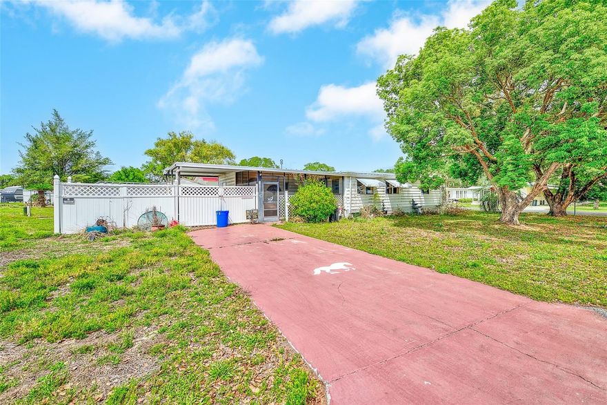 Opportunity awaits with this 3-bedroom, 2-bath manufactured home situated on a spacious corner lot in Zephyrhills with no HOA or lot rent. Offering a generous layout, the home features a large living area with plenty of natural light, a separate dining space, and a functional kitchen with ample cabinet storage and room to update and make your own. The bedrooms offer flexibility for a variety of uses, including guest space, office, or hobby rooms.

The home is livable as-is but would benefit from updates and repairs, making it ideal for investors, flippers, or buyers looking for an affordable property they can improve over time. With its layout and location, it also presents a great opportunity for a seasonal getaway or rental once refreshed.

Outside, you’ll find a covered carport area, additional storage, and a yard with room to enhance and customize. The corner lot provides extra space and added privacy compared to interior homes.

Conveniently located with easy access to local shopping, dining, and major roadways, this property offers strong potential in a growing area. Whether you’re looking for your next investment or a project to transform into your own retreat, this is one worth seeing.