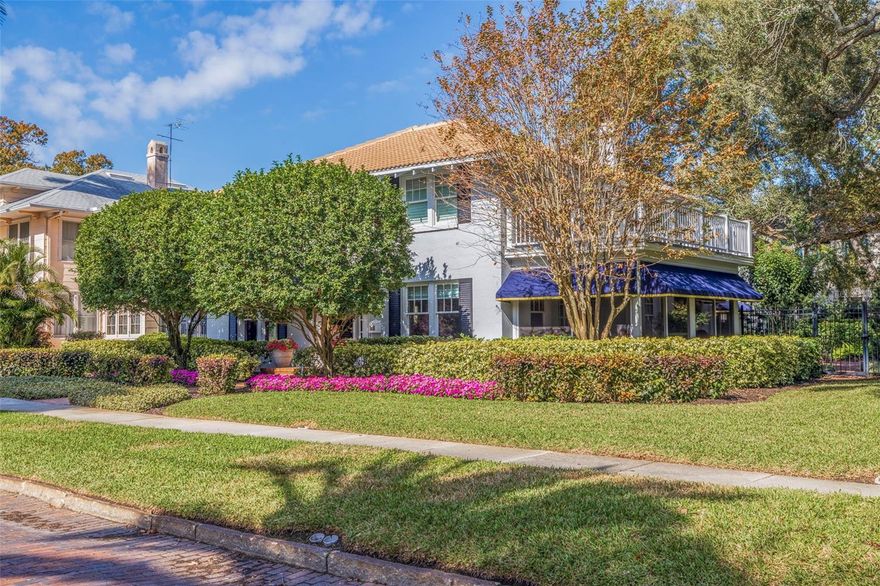 Located on a picturesque brick street in the prestigious Old Northeast neighborhood, this exquisite colonial-style BLOCK home offers a luxurious blend of historic charm and modern conveniences. Boasting five bedrooms and three and a half baths, the residence is ideally located just steps from the captivating Tampa Bay waterfront and the serene North Shore Park. Situated on a spacious 10,010-square-foot lot, the meticulously maintained property showcases the grandeur of a 1920s home with contemporary updates. The elegant entry leads to a formal living and dining room adorned with timeless architectural features, including inlaid hardwood floors, crown molding, and a wood-burning fireplace. The gourmet kitchen is a culinary haven with a Sub-Zero refrigerator and freezer, Dacor natural gas cooktop, double ovens, newer quartz countertops, island seating, and solid wood cabinetry. The expansive family room opens to a beautifully landscaped backyard, creating an idyllic setting for outdoor living and entertaining. Additional highlights include a wine room, office/gym, and a private guest suite accessible via a rear staircase. Upstairs, the primary bedroom suite impresses with plantation shutters, a walk-in closet, and a spa-like bath featuring marble finishes and a grand balcony overlooking sparkling Tampa Bay. Three additional guest rooms and a bath complete the second floor. The property also features an indoor laundry room and an attached two-car garage for added convenience. This exceptional residence provides a rare opportunity to own a Florida retreat, perfectly positioned near Northshore Park and the waterfront, offering easy access to nature and leisure activities. Within walking distance to St. Pete's vibrant downtown, residents can enjoy an array of amenities, including top-notch restaurants, museums, the newly built pier, art galleries, shopping venues, bayfront parks, the historical Vinoy hotel, and concerts in the park. Don't miss the chance to claim this extraordinary gem, combining timeless elegance, modern upgrades, and an unbeatable location in Historic Old Northeast. Make this property yours today and relish the unparalleled lifestyle it promises!