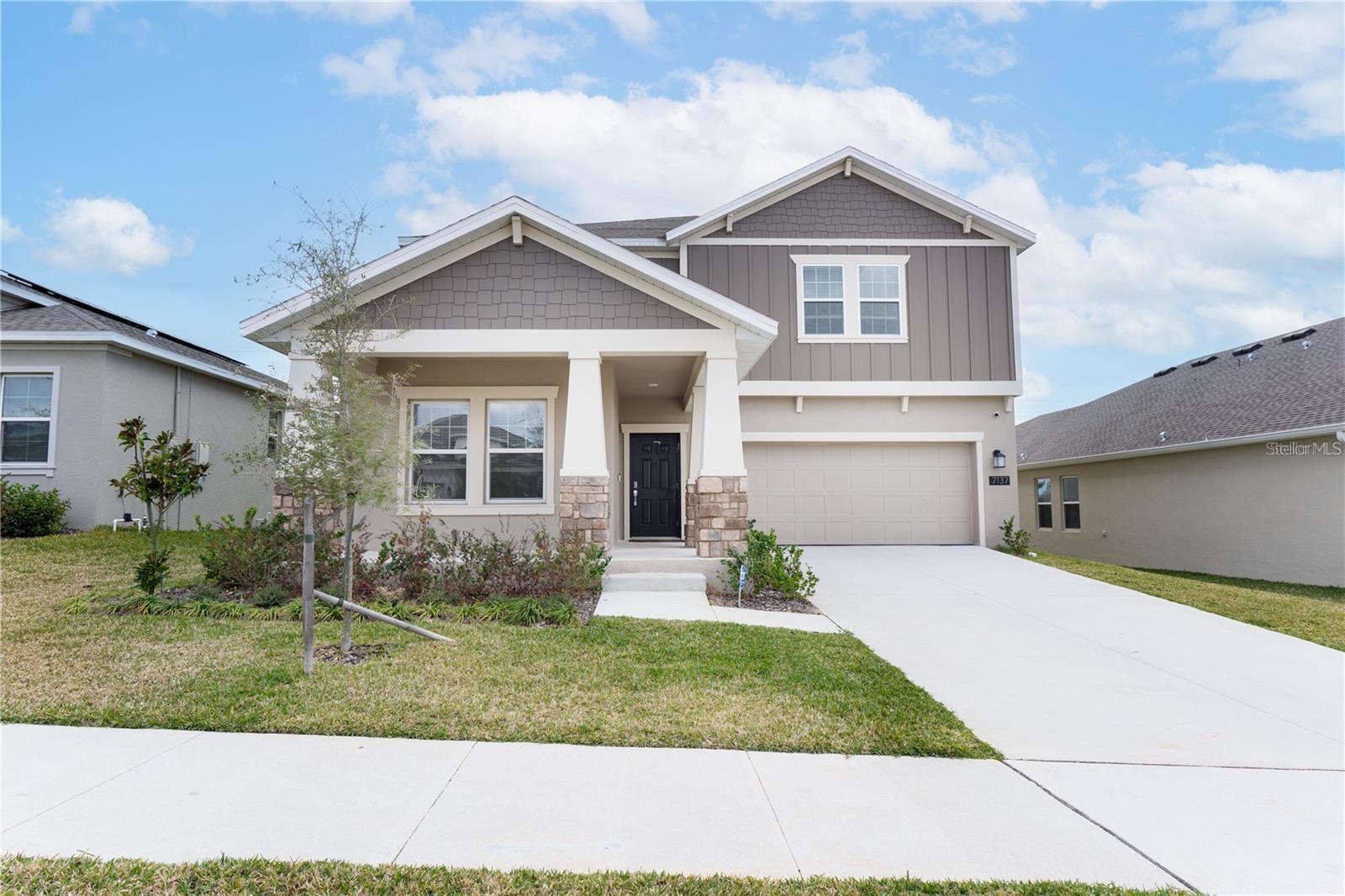 Why wait for a new construction when you can have this stunning home TODAY! Enjoy modern upgrades and a beautiful interior flooded with natural light. Various perks in this large home include a spacious living area, an amazing kitchen with a large island for your breakfast on the go, stainless steel appliances, and stylish cabinetry, all perfect for hosting get-togethers. Enjoy a separate dining room as well, ideal for formal gatherings. The primary ensuite is a dream with double vanities, a separate shower, a wonderful soaking tub, and an oversized walk-in closet, directly connected to your laundry room for convenience. Entertain guests in your backyard on your private covered patio. Located in "The City of Natural Charm," Groveland is up and coming in the Lake County, FL area. Just a quick drive from the expanding Turnpike, come check out the perks of being in the Trinity Lakes community! This community is packed with incredible amenities that are sure to impress. Whether you want to relax in our fantastic oversized resort-style pool, watch the little ones have a blast in the splash pad, or take your furry friend to the dog park, we've got you covered. You can also enjoy walking trails, a fishing pier, and a fitness center. Best of all, all the schools are located within 15 minutes of the community, and shopping and dining are just a short drive away. Come and experience luxury living in a convenient, growing location! Call today to schedule your private showing!