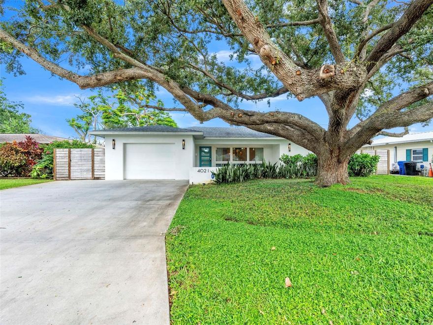 This stunning two bedroom, two bathroom designer home in Central St. Pete offers style and function with every detail. The open kitchen features a custom oversized island with seating for eight, quartz countertops, marble backsplash, and designer lighting. Custom built-ins and window treatments add character, while the large laundry room with sink provides convenience.

Enjoy effortless entertaining on the tiled back patio with dining space and mounted television. Located in Flood Zone X, this home combines peace of mind with modern design just minutes from downtown, beaches, and all that St. Pete has to offer!