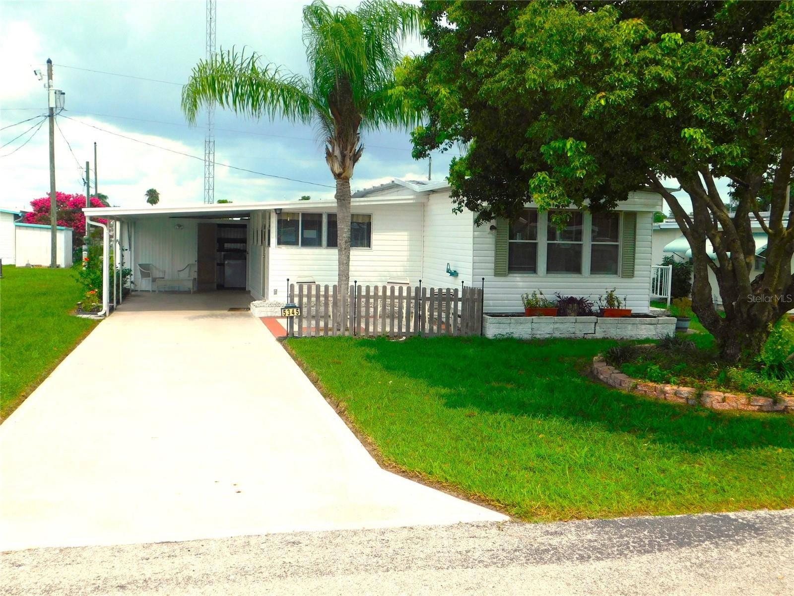 Although this is a charming 2-Bedroom, 1.5-Bath Single Wide in Betmar Acres – 55+ Golf Community, This well-kept 2-bedroom, 1.5-bath single wide home has a Great Secret. It has a internet broadcast tower which provides you with FREE internet for life! This home also offers a practical layout with a comfortable living area, a bright eat-in kitchen, and a Florida room perfect for entertaining. The master has a private half-bath for added convenience. The main bathroom includes a corner shower. Outside, you’ll find a covered carport, a utility shed with washer and dryer, room for a golf cart, and a cute front patio—ideal for morning coffee, relaxing with a book, or entertaining friends.Betmar Acres is a pet-friendly community with low HOA fees and no lot rent—you own your land. Residents enjoy access to three golf courses, swimming pools, shuffleboard, pickleball, and a full calendar of social events. It’s a laid-back, friendly neighborhood perfect for active retirement living.