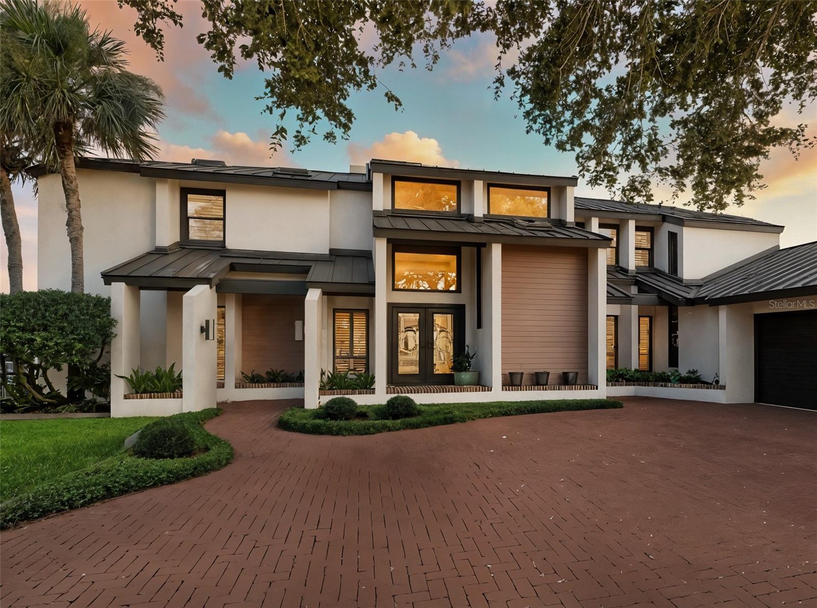 Landmark riverfront residence in the prestigious Venezia community of New Smyrna Beach. Boasting 150+ feet of prime, deep-water frontage, this classy 4 bedroom/3 bath/2 half bath home is perfectly positioned, high at the end of Venezia’s final, private cul-de-sac, offering panoramic views from nearly every room. With space for a large boat and immediate access to the Intracoastal Waterway, this handsome, contemporary home is a boater’s dream, offering fantastic living areas inside and out - Sophisticated yet comfortable, combining easy elegance with the best of Florida waterfront living. Highlights include a large pool, multiple outdoor covered patios, a private dock with a floating SUP/kayak launch, new whole home generator and a new, standing seam roof. Adding to its appeal, 448 Quay Assisi is ideally located halfway between the vibrant arts district of Canal Street and the lively coastal energy of Flagler Avenue—offering the best of both worlds, just moments from your door. More than a house, this property is a statement and a destination - and the epitome of all NSB has to offer.