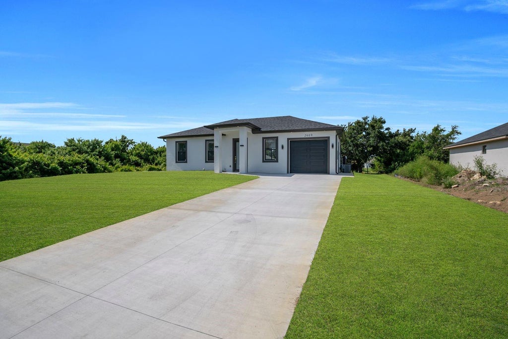Photo of 2609 21st Street SW, Lehigh Acres, FL 33976 (MLS # A4698256)