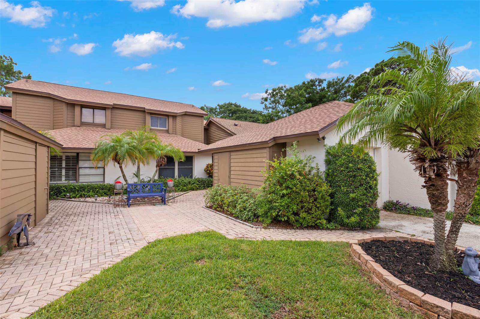 Welcome home to this lovely, move-in-ready 2-bedroom + loft, 2-bath home located in the desirable Philippe Bay community, just a short stroll from scenic Philippe Park and minutes to downtown Safety Harbor! From the moment you arrive, you’ll appreciate the private 1-car garage, extended driveway, and welcoming curb appeal. Step through the front door into an open, airy main living space featuring soaring two-story ceilings and an abundance of natural light. The wood-burning fireplace anchors the spacious living room, and the adjacent dining area is perfect for entertaining or casual meals. The updated kitchen includes granite countertops and wood cabinetry, stainless steel appliances, pantry closet with built-in shelving, dedicated laundry room with bonus second refrigerator, two sets of sliding glass doors lead out to your private screened-in lanai, ideal for indoor-outdoor living and dining! Located privately on the first floor is your primary suite, featuring dual wall closets for ample storage, a spacious en suite bathroom that includes step-in shower, separate tub/shower combo, dual-sink vanity with extra cabinetry and secondary hallway access for guests. Head upstairs to your light and bright open loft area—perfect for a home office, second living area, or guest space. The second bedroom includes a generous wall closet and there is an additional full bath with tub/shower combination. Additional closets upstairs offer excellent storage options as well. Head outside to relax in your screened-in lanai—a perfect spot for morning coffee or evening gatherings. The brick paver patio extends the living space, great for grilling or outdoor seating, and the fenced backyard offers added privacy and peace. The community perks are numerous and include private resident entrance to Philippe Park plus a community pool and pickleball court. Located only minutes to Downtown Safety Harbor, shops, dining, and waterfront parks, this home offers a flexible layout, modern upgrades, and the Florida lifestyle you’ve been looking for. With rare availability in Philippe Bay, this is an opportunity you won’t want to miss. Schedule your private tour today.