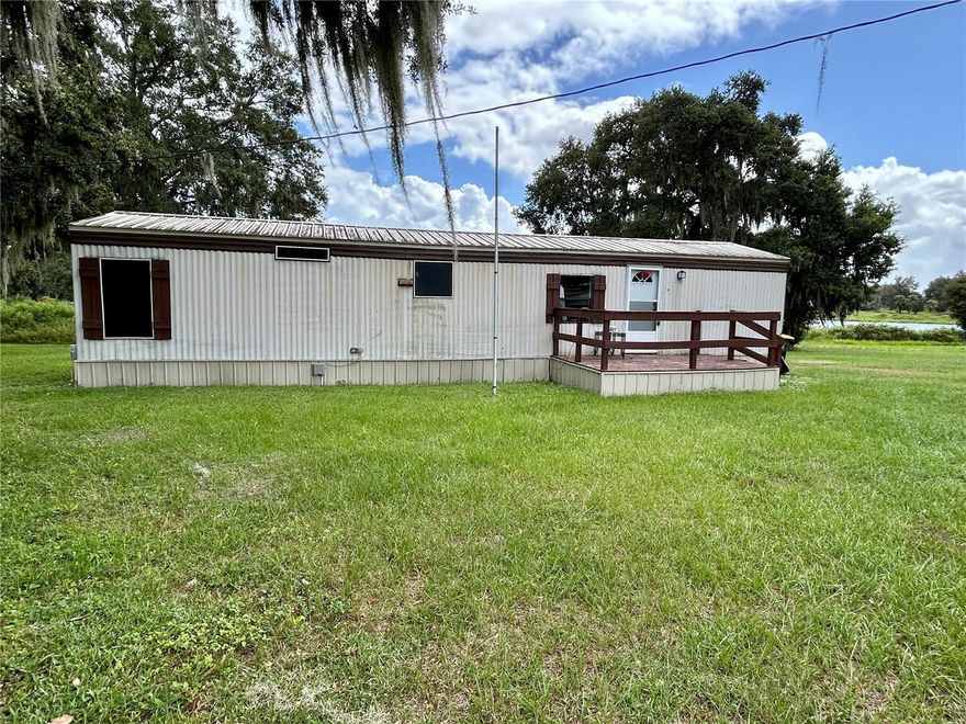 PEACEFUL SETTING for this 2 bedroom, 1 bathroom home with serene lake views. Situated on 2¼ Acres, this Move-In READY home features stylish vinyl plank flooring throughout, granite countertops and washer dryer hookups. Call today to schedule your tour!