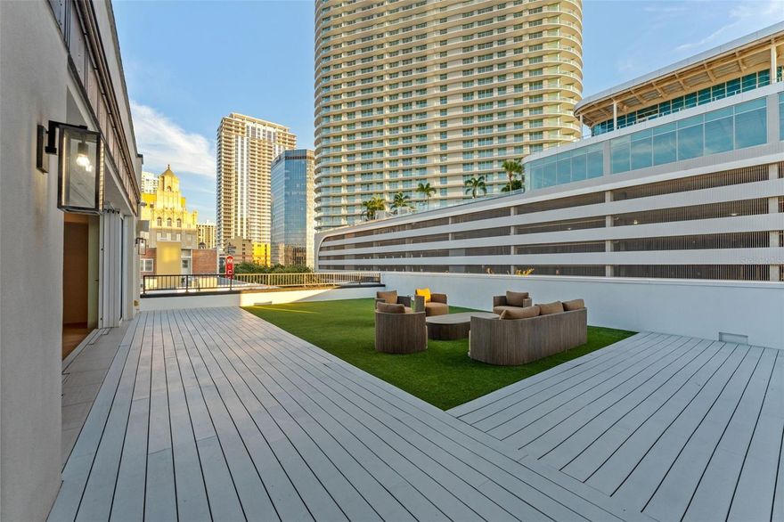 Penthouse Perfection on Central Avenue! FULLY FURNISHED and MOVE IN READY!
Experience elevated living in this exclusive penthouse residence — one of only three private units in a boutique building along vibrant Central Avenue. With direct elevator access into your home, this sanctuary blends modern design, state-of-the-art smart home technology, and an unbeatable downtown location.

Step inside and be greeted by exposed brick walls, hardwood floors, and thoughtfully curated designer lighting. The chef’s kitchen is a masterpiece, featuring a Wolf gas range, Bosch dishwasher, marble countertops, built-in Liebherr refrigerator, Sub-Zero wine fridge, and walk-in pantry.

Unwind in the open-concept living area, complete with a gas fireplace, integrated media center, and seamless access to your private outdoor patio — a rare downtown oasis with turf, built-in speakers, and skyline views. The sliding glass doors fully retract, creating a true indoor-outdoor living experience.

The primary suite is a retreat of its own, featuring French doors, a private balcony overlooking 1st Avenue, exposed brick accents, and a custom walk-in closet with built-ins. Its spa-inspired primary bath impresses with floor-to-ceiling tile, dual vanities, a rainfall shower, and a deep luxury soaking tub. Just off the bath, a private ensuite laundry room offers a wash sink and modern cabinetry above the washer and dryer — a thoughtful, functional design.

A secondary bedroom offers its own upscale touches, including a skylight with motorized shades, integrated KEF speakers, and a dual-vanity ensuite bath with built-in storage.

This home is also a fully integrated smart home, allowing you to control lighting, climate, sound, and automated window coverings — including the skylight — all from your phone or tablet.

Additional highlights include:

*Three mounted televisions

*Garage with lift parking for two vehicles

*Private storage closet

*All utilities, Wi-Fi, pest control, and once-monthly cleaning included.

Located in the heart of downtown St. Pete, you’re steps from the city’s best dining, boutiques, galleries, and nightlife — yet tucked into a serene, low-density building where privacy reigns.

Available now for discerning renters seeking a rare combination of exclusivity, luxury, and location.