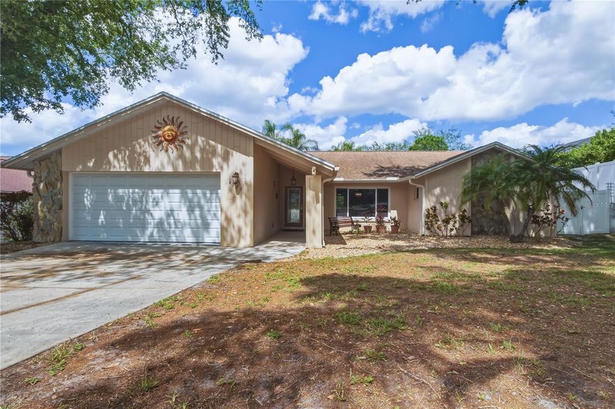 Lake Valencia in Palm Harbor! 3 bedrooms, 2 full baths, 2 car garage, office/den and a DEEP solar HEATED pool! The kitchen is updated to include newer countertops, cabinets, backsplash and MORE. The kitchen opens to the formal dining area and family room with a functioning wood burning fireplace.  The master bedroom features vaulted ceilings and french doors lead you to the private office with sliding door access to the pool area and its own mini-split AC. The other bedrooms are spacious and have built in shelving in the closets. The roof was replaced in 2019. StormBreaker Plus 300VL IMPACT RESISTANT windows throughout the home.  This location is Palm Harbor Perfect, close to John Chestnut Park, plenty of shopping, restaurants for dining, championship golf, world class beaches and top rated schools. Great Location! Great Home! Great Florida Living!