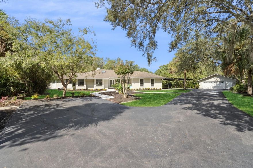 Designed for both comfort and style, this unique retreat, nestled on 1.2 acres in the prestigious Markham
Woods corridor, offers the perfect blend of privacy, comfort and functionality - featuring a 2800 SF Main
Home and an 880 SF Guest House for multi-generational family living.
The property has an unbeatable location - just minutes from I-4, SR-429 and SR-417. Families benefit
from the area’s employment opportunities and great schools - while outdoor and sports enthusiasts will
love numerous activities including golf, tennis and soccer, plus miles of preserved scenic walking and
biking trails as well as the nearby Wekiva and St. John's River preserves.
As you enter the property via a private driveway, you’ll find a serene and inviting atmosphere, while an oversized 2-car garage, a 2-car carport, and spaces around the entire driveway provide ample parking arrangements.
There is also a separate shed and storage room and, with NO HOA restrictions, you're free to bring your RV, boat or
trailer!
Once inside the 3BR 2BA 2800 SF Main Home, you’ll discover a thoughtfully customized home boasting
an open and bright layout - featuring vaulted ceilings over a spacious great room and dining room, an open
kitchen equipped with a large pantry and upgraded appliances including gas cooking, a customized bar
lounge for entertaining leading to a beautiful Florida room to bring the outdoors in, a separate large
office/den with an abundance of cabinetry, and a fully equipped laundry room with custom storage.
In addition to the Main Home, the separate 880 SF Guest House provides a complete and perfect home for
visitors, parents, “extended” single or married children, or for rental income. This charming Guest House
features one-bedroom, one-bathroom, living area, open kitchen with a four-seater island, and an outdoor
deck overlooking a reserve area separate and private from the Main House. The Guest House also
features additional “flex” living space for a study, second bedroom or even a nursery!
The deed also includes Lot 9A according to the Seminole County records, for a total of 1.2 acres. With its location and with every detail carefully considered, this property is a rare find waiting for the perfect
family. Don’t miss the opportunity to experience this unique home. Call us today for your private tour!