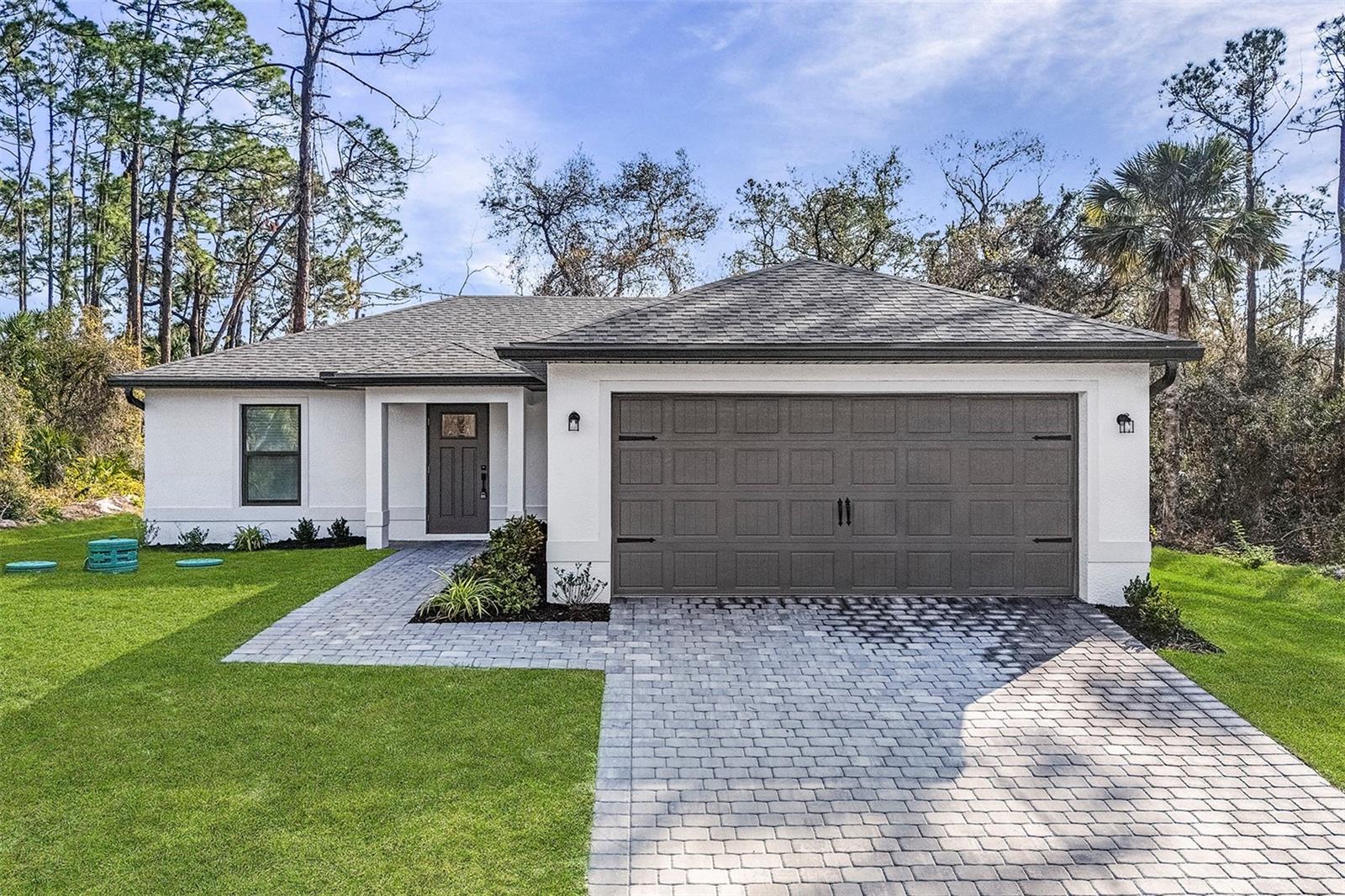 PRICE REDUCED! MOVE IN READY! Located in the highly sought-after North Port area, the Delray floor plan by LGI Homes offers exceptional value and functionality. This charming 3-bedroom, 2-bathroom home features an open-concept living space, flooded with natural light, perfect for both entertaining and relaxing. Every home in this community comes equipped with premium features, including energy-efficient Whirlpool kitchen appliances, luxurious granite countertops, beautiful wood cabinetry, and the added convenience of an attached garage. A perfect blend of comfort, style, and practicality awaits you!