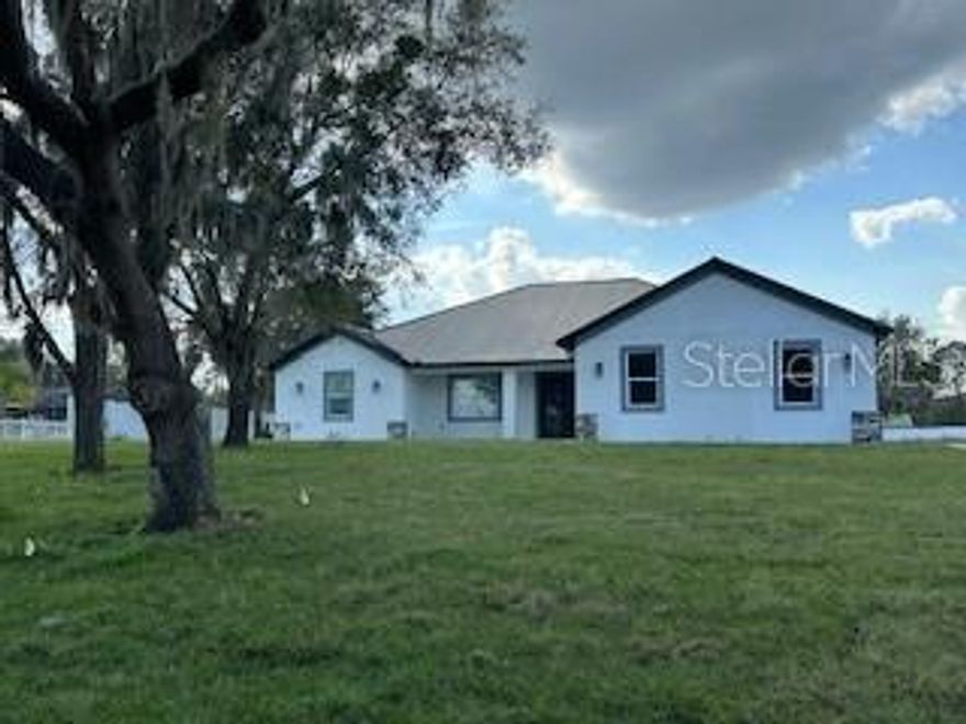 Welcome home to this beautiful brand new 4 bedroom, 5 bathroom home on a one acre lot across the street from Lake Weohyakapka in Lake Wales. The home is located on a quiet street surrounded by mature trees. Upon entering the foyer, you will see the dining room to the left and the kitchen and living room right ahead. The ceramic floor is gorgeous and is throughout the entire home. The tray ceilings and fixtures are a perfect touch adding to the beauty of the home. There is a pantry off the kitchen for all of your kitchen needs. Upon entering the master suite on the left hand side of the home, you will again be greeted by a gorgeous tray ceiling and French doors that open to the outside lanai. There is a walk in closet and the master bath is perfect! There is a double vanity with a walk in shower. Across the home on the right side you will find the laundry room off the garage complete with washer and dryer, a double car garage which is extra deep for additional storage. Bedroom 2 opens to a jack and jill bath complete with double vanity and walk in shower, which is shared with bedroom 3. Bedroom 4 is alongside the other two bedrooms. The 4th bathroom has a combination shower/bathtub. The covered lanai is waiting for you to relax after a long day! There is an area set up for an outdoor kitchen. The 5th bathroom is a stand alone full bathroom off of the lanai. It has an unfinished area that would be perfect for an indoor sauna or additional storage - you decide! Schedule your showing now to ensure you do not miss out on this stunning brand new home which could be yours!