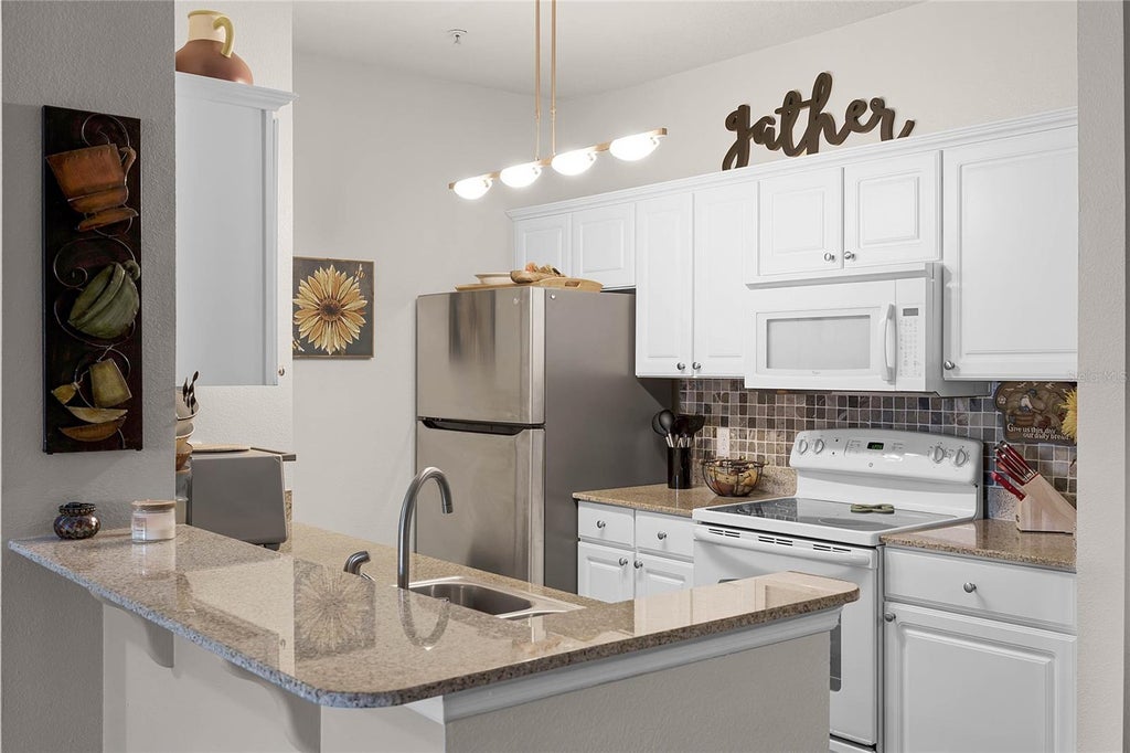 Photo of 430 Southern Pecan Circle #207, Winter Garden, FL 34787 (MLS # O6425239)