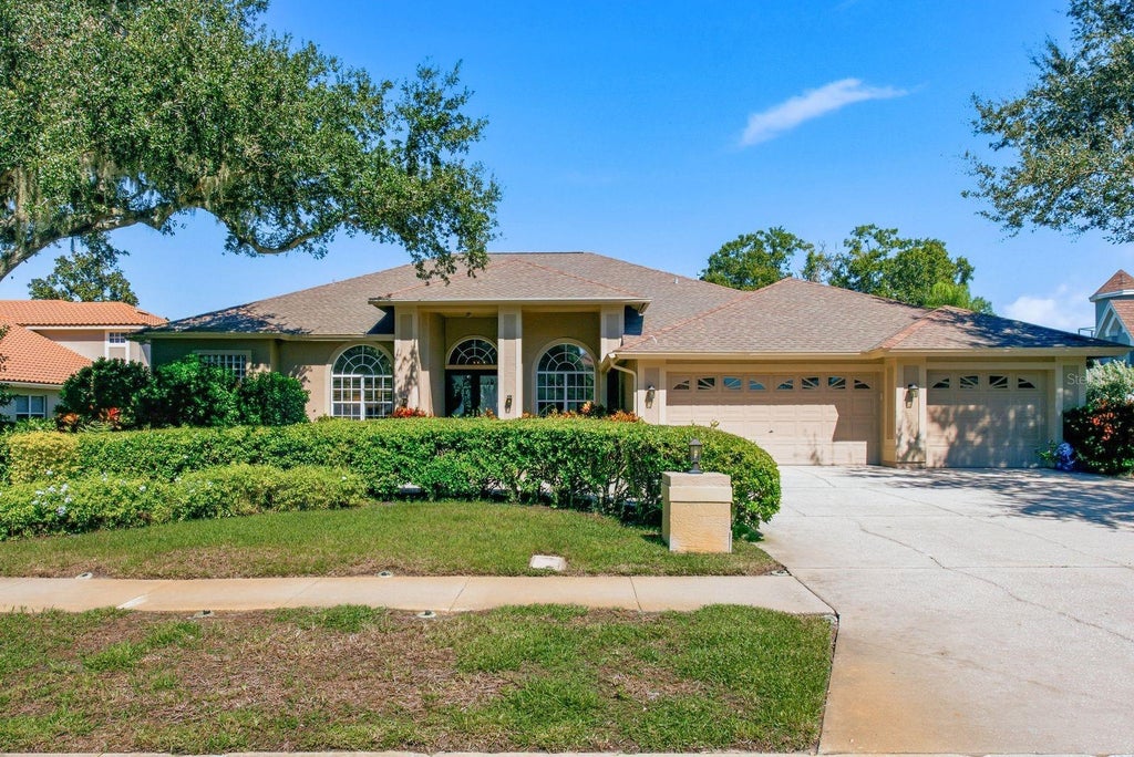 Photo of 3763 Executive Drive, Palm Harbor, FL 34685 (MLS # TB8553073)