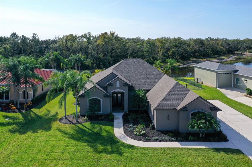 Enjoy the Best of Both Worlds — Country Living Just Minutes from Pristine Beaches! Twin River is a unique & beautiful community with large lots with room between homes, multiple playgrounds, basketball, soccer, picnic pavilions, nature trails and much more all with low HOA fees and NO CDD fees!!
This exceptional estate home, set on over half an acre, offers true indoor–outdoor Florida living. With a southern-exposure lanai and pool area overlooking a peaceful pond and private wooded preserve, you’ll enjoy sun-soaked days, tranquil views, and total privacy. The expansive panoramic screened porch seamlessly blends the outdoors with your covered lanai, providing two inviting seating areas perfect for entertaining or unwinding.
Step inside through the impressive 8' Therma-Tru hurricane-rated double doors and instantly feel the luxury. The spacious family room features a floor-to-ceiling stone fireplace wall, complete with a recessed TV niche for a clean, modern look.
The gourmet kitchen is a chef’s dream, offering soft-close wood cabinetry with 42" uppers, under-cabinet lighting, a double-sided island, bar-height granite counters, and a walk-in pantry with built-in shelving. The sunny breakfast nook comfortably seats six.
Retreat to the elegant primary suite with dual granite vanities, a large linen closet, a separate walk-in shower, a freestanding soaking tub, and a private water closet. Guest bedrooms 2 and 3 are thoughtfully positioned on the opposite side of the home for privacy, along with a full guest bath featuring a dual vanity and linen closet.
The well-appointed laundry room includes a sink and generous storage. Travertine flooring flows through main living and wet areas, while all four bedrooms feature engineered hardwood. The interior was recently painted in warm earth tones, highlighted by crown molding in the main living areas, primary suite, and front bedroom/office.
Abundant hurricane-impact windows bring in natural light and are dressed with custom wood plantation shutters. The sliding glass doors and garage doors are also hurricane-rated. Additional upgrades include new garage door openers and Icynene spray-foam insulation in the attic of both the home and garage, ensuring comfort and energy efficiency year-round.
Car enthusiasts and hobbyists will love the oversized garage, finished with premium RaceDeck flooring and plenty of space for all your Florida toys. A long driveway provides ample guest parking, and the refreshed landscaping features easy-care plantings. The sparkling pool includes deck fountains, offering a relaxing ambiance.
Residents enjoy access to a community boat ramp on the Manatee River, perfect for launching kayaks, canoes, or boats for a day on the water.
Be sure to explore the virtual tour and experience the “Country WOW Factor” for yourself!
________________________________________