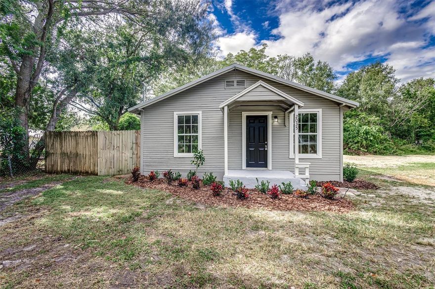 Spread out at this newly renovated home as it sits on a quarter acre corner lot! Inside, the kitchen has been completely updated with new stainless-steel appliances, granite countertops, and cabinets providing plenty of storage space. The new flooring installed throughout the home creates a seamless flow from room to room, including the living room and spacious laundry room. The interior also features a new A/C, new electric water heater, updated electrical and plumbing, updated bathroom, all new ceiling fans and light fixtures, and fresh paint. Outside, the home features a covered front porch, new septic tank and drain field, large yard on a great corner lot, new landscaping, fresh paint, and wood fence along your neighbors to the south and west.