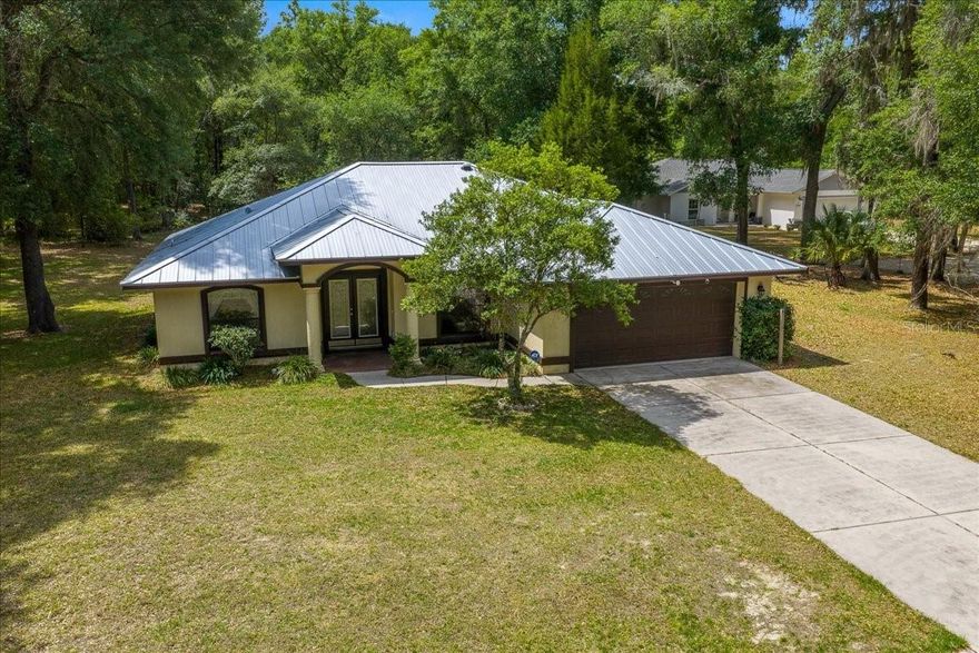 If you are looking for a home that prioritizes space, privacy, and a sensible layout, this 3-bedroom, 2-bathroom residence in a premier Citrus Springs location is a must-see. Situated on just shy of a half-acre, this property offers a level of quiet serenity that is becoming increasingly rare.

The interior features a highly functional floor plan with just under 2,000 total square feet, where every inch is designed for effortless daily living. From the main living area, a large slider opens to an expansive, oversized porch that looks out onto a backyard teeming with nature; it is common to see deer and turkey wandering through the landscape, creating a peaceful and personal sanctuary.

For added peace of mind, a brand-new full metal roof was installed in 2023, offering incredible durability and long-term protection. The home also features an energy recovery system that utilizes the AC condenser to help supply hot water, providing an added layer of energy efficiency and cost savings.

Complete with two detached sheds for ample storage or workshop space, this home perfectly balances utility with the beauty of a quiet country lifestyle.
