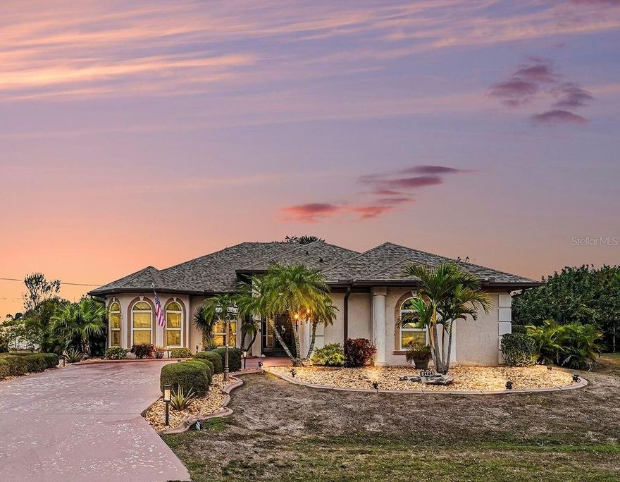 One of-a kind North Port home offering exceptional upgrades and outdoor living. Major improvements include a new roof and windows (2024), updated AC and water heater (2023), and newer appliances throughout. This west-facing residence features granite countertops, soft-close cabinetry, a breakfast bar, a double convection oven, tray and coffered ceilings, built-in shelving, and zero-corner sliding glass doors, along with upgraded luxury vinyl flooring throughout the home. The primary suite offers two walk-in closets, double sinks, and a walk-in shower with dual heads. Additional highlights include a screened front porch, two-car side-entry garage with AC vent, generator hookup, Ring cameras, washer and dryer included, and city water and sewer. The fully fenced backyard is designed for entertaining with a saltwater above-ground pool, hot tub, outdoor fireplace, firepit, and lanai lighting. Conveniently located less than five miles from I-75 and minutes from schools, shopping, dining, beaches, and US-41.