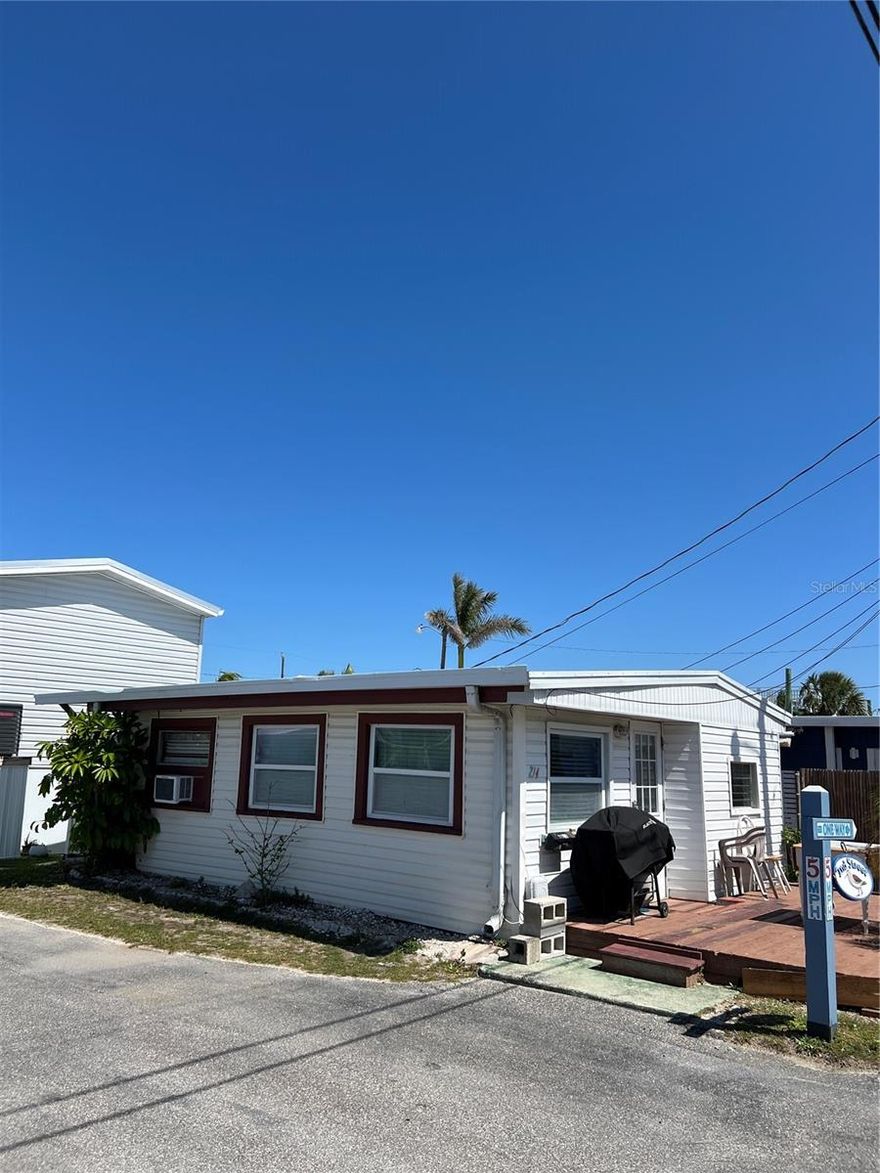 Sandpiper Resort Co-Op is a 55+ community. Imagine a charming retro mobile home tucked away in a cozy co-op community on the idyllic Anna Maria Island. This one-bedroom, one-bath home is a nostalgic gem, exuding mid-century charm with its vintage details and laid-back coastal vibe. A small front porch with wicker chairs or a hammock invites you to relax and enjoy the balmy Florida breezes.
Inside, the living room is cozy and functional, with a comfortable but simple sofa, a coffee table. The kitchen has a vintage feel with new countertops. Everything is compact and thoughtfully arranged to make the most of the limited space. The bedroom is small but comfortable, giving the room character.
The bathroom is practical but packed with personality, featuring simple yet effective storage solutions to maximize the limited space.
This mobile home feels like a little slice of nostalgic paradise, offering a cozy retreat in a laid-back, community-oriented atmosphere on Anna Maria Island. The co-op setting ensures a friendly, tight-knit vibe with neighbors who share the same appreciation for the charm and simplicity of island living.