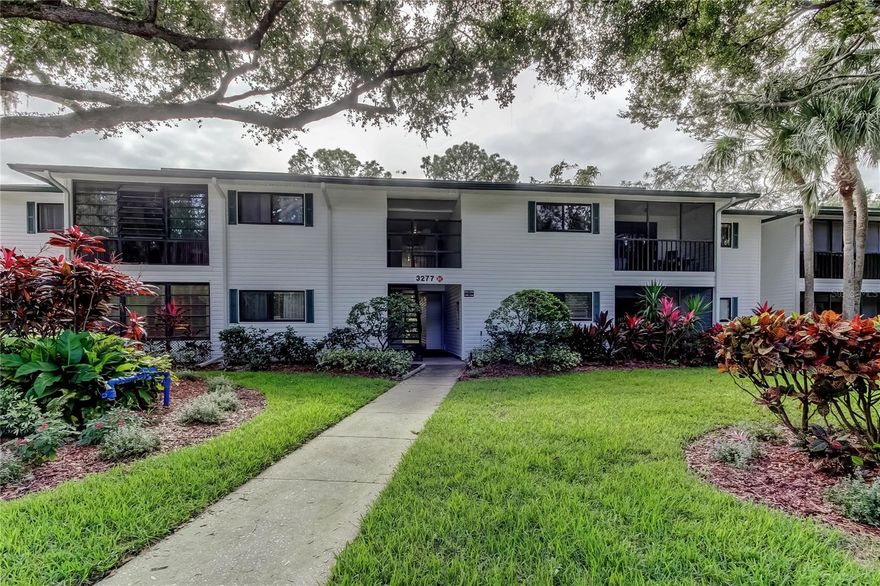 HURRY this one will not last long! This 2-bedroom, 2-bathroom condo on the 2nd floor in Palm Harbor offers a blend of comfort, convenience, and Florida charm. The community is gated and the Belcher road entrance is for residents only. All units are corner/end units with a semi-private entrance to the unit. Master bedroom and the 2nd bedroom include full en-suite bathrooms and walk in closets. Laundry is inside, pantry style off the kitchen. Open living room/dining room space is light and bright with the covered and screened balcony providing a lot of natural light. Close to shopping, restaurants, school and much more.