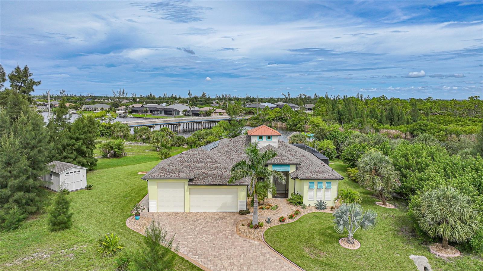 Welcome to 9149 Lane Court, a rare waterfront sanctuary that blends luxury with serenity. Nestled on an oversized lot in one of Port Charlotte’s most desirable boating communities, this exceptional home offers unmatched privacy, sweeping water and preserve views, and direct sailboat access to the Gulf of Mexico—without a single bridge between you and open waters. From the moment you arrive, the peaceful setting and elegant design create an atmosphere of tranquility and exclusivity.
Privacy is one of this home’s defining features. With no neighbors behind you and only one home in view from the front, the residence is surrounded by the beauty of untouched preserve land, offering a sense of retreat rarely found in waterfront living. The oversized lot further enhances the seclusion, ensuring quiet mornings and peaceful evenings spent taking in the natural beauty that surrounds you.
For boating enthusiasts, the property delivers the best of Florida’s Gulf Coast lifestyle. Situated on a deep-water canal, you’ll enjoy effortless sailboat and large-vessel access with no bridges to restrict your journey. Whether you dream of sunset cruises, weekend getaways, or full-day excursions, your adventure begins right from your backyard dock.
Adding to its appeal, the home includes a unique RV garage complete with a four-post vehicle service and storage lift—perfect for car collectors, hobbyists, or travelers. The property is also equipped with 30–50 amp generator connections and a 250-gallon tank, offering both convenience and peace of mind. Few homes can offer this combination of practicality and luxury.
Inside, the residence is light-filled and thoughtfully designed with expansive windows framing the preserve and water views. The open living areas, gourmet kitchen, and refined finishes create a warm yet sophisticated environment ideal for entertaining or quiet moments at home. The primary suite offers a serene escape, while the additional bedrooms provide comfort and privacy for family and guests alike.
This home has also been extensively upgraded to provide both luxury and efficiency. A solar system ensures impressively low utility bills, while a new roof and AC system, both installed in 2023, deliver peace of mind for years to come. The pool heater was replaced in 2020, allowing year-round enjoyment of the sparkling pool and spa. Every detail has been carefully curated to enhance comfort, efficiency, and long-term value.
At 9149 Lane Court, you’ll discover more than a home—you’ll discover a lifestyle defined by quiet privacy, boating freedom, and thoughtful luxury. With its preserve backdrop, unobstructed Gulf access, rare RV and storage amenities, and a host of modern upgrades, this property offers a once-in-a-lifetime opportunity to experience waterfront living at its most refined. Schedule your private showing today and step into the peaceful elegance of Florida’s Gulf Coast.