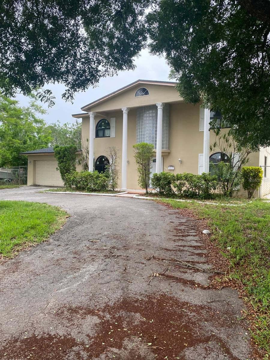 Welcome to 1100 NW 203rd Street—a rare opportunity to own a large, two-story single-family home in the desirable Country Club Estates community of Miami Gardens. Boasting 4 bedrooms, 3 full bathrooms, and over 2,600 square feet of living space, this well-maintained property offers the perfect blend of comfort, functionality, and Florida lifestyle. This CBS home is set on an expansive 10,000 sq ft lot with lush landscaping and a circular driveway, offering ample curb appeal and parking. Inside, you'll find a thoughtfully designed layout featuring a spacious living room, formal dining area, and separate family room—ideal for entertaining or relaxing with loved ones. The first floor includes one bedroom and a full bath, perfect for guests or multi-generational living. Upstairs, you'll discover three generously sized bedrooms, including a large primary suite with ample closet space and natural light.