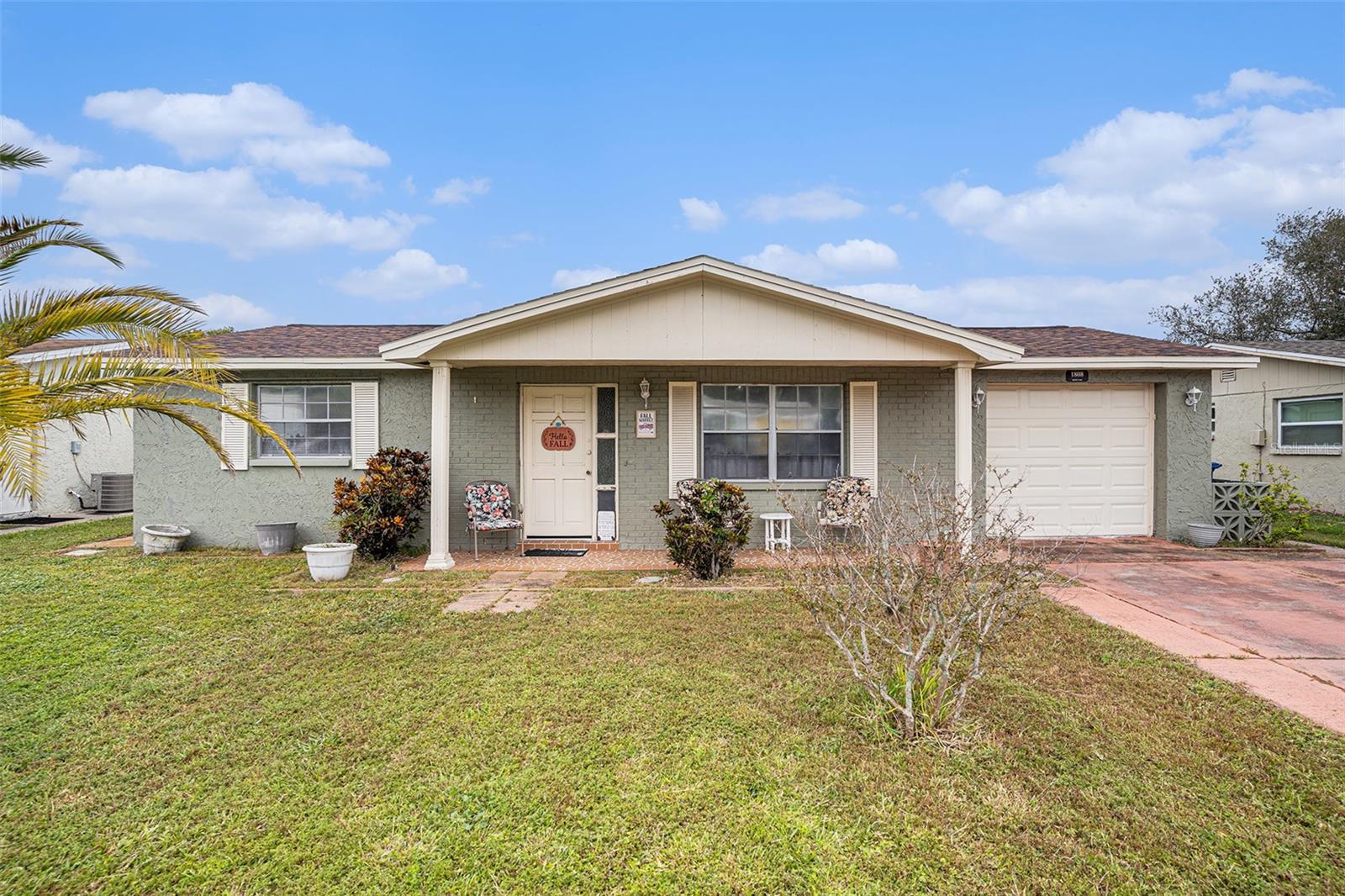 Welcome to this charming 2 bedroom, 1 bathroom home in Holiday with NO HOA and NO flood zone! Featuring a newer roof (2020) and AC (2022), this home offers peace of mind with major updates already completed. Freshly painted inside and out, the open layout provides comfortable living with plenty of natural light. Enjoy a private backyard with room to relax, garden, or entertain. Conveniently located near shopping, dining, schools, and just minutes from Gulf beaches.
