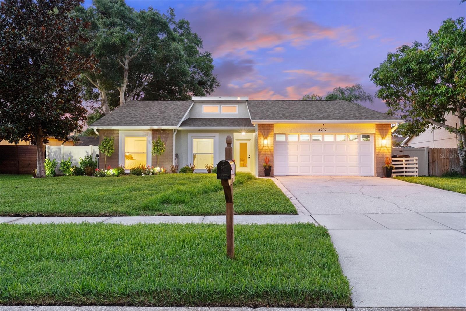 CARROLLWOOD VILLAGE PROPER POOL HOME—RENOVATED, NO HOA & NEW ROOF (2024)! This beautifully updated 3-bedroom, 2-bath, one-story pool home is set slightly above street level in a quiet, non-HOA neighborhood in desirable Carrollwood Village. Located in Flood Zone X, the home feels secure and move-in ready with a flowing open layout, abundant natural light, and beautiful sunsets from the private backyard. As you enter, vaulted ceilings and sliding glass doors frame your view straight to the pool oasis. To the left, two bedrooms, a full bath, the kitchen and an additional set of sliders offer seamless access to the outdoors. The en suite primary bedroom to the right features access sliding glass doors to the lanai and an attached bath with dual sinks, granite countertops, a standing shower, and custom pull-down pleated shades. The 2-car garage is located at the front of the home. Throughout the home—including the living room, kitchen, bedrooms, and all rear-facing spaces—you’ll find HURRICANE-GRADE DOUBLE-PANE WINDOWS AND SLIDERS (2025), offering both safety and energy efficiency. Outside, enjoy an open-air pool (no screen), covered patio, lush landscaping, mature trees, a sprinkler system, and a fully fenced yard with dog run, outdoor lighting, and a brand-new shed. The vinyl fencing includes safety locks for added peace of mind, and interior/exterior security cameras convey with the sale. The seller spared no expense with renovations including ROOF (2024), AC SYSTEM (2025), WATER HEATER (2024), IRRIGATION SYSTEM (2025), interior paint, bedroom flooring, kitchen appliances, washer/dryer, garage opener, toilets, and faucets. The pool is equipped with updated lighting, filter, handrail, and custom color-changing LED lights. This home has passed a 4-point inspection within the last year and offers turnkey system updates for buyer peace of mind—making it an ideal low-maintenance choice for a couple just starting out or anyone looking to downsize in style. Designed to evoke the Florida lifestyle, this home is perfect for entertaining, relaxing, and enjoying indoor-outdoor living year-round. Zoned for Essrig Elementary, Hill Middle, and Gaither High, and near top-rated private schools including Carrollwood Day School. Enjoy easy access to Whole Foods, fine dining, bars, elite gyms, parks, golf courses, and local walking trails. Centrally located just minutes from Dale Mabry Highway, the Veterans Expressway, Tampa International Airport, and the beaches in under 40 minutes. Please call to book your private showing today—this neighborhood is coveted, and this home will not last.