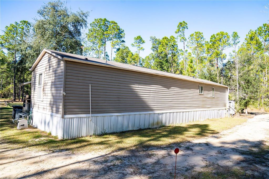 Photo of 132 Nutmeg Trail, Interlachen, FL 32148 (MLS # TB8458684)