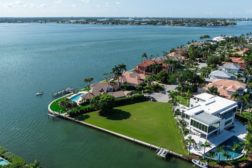 A rare opportunity on coveted Bird Key—this one-of-a-kind property offers nearly 200 feet of waterfront with the unique “one in” effect, providing sweeping Sarasota Bay views while enjoying the protection of being just off the direct bayfront. The site’s orientation presents stunning vistas of downtown Sarasota, the John Ringling Causeway Bridge, and shimmering bay waters. Just minutes to world-renowned St. Armands Circle and Sarasota’s vibrant downtown, Bird Key is one of the area’s most prestigious neighborhoods. Proposed plans by Dynan Construction envision a remarkable estate designed to maximize the expansive water frontage and unparalleled views, while still offering the ability for a new owner to personalize the final design. Now is your chance to secure this superior lot and create a signature Sarasota residence tailored to your vision.
