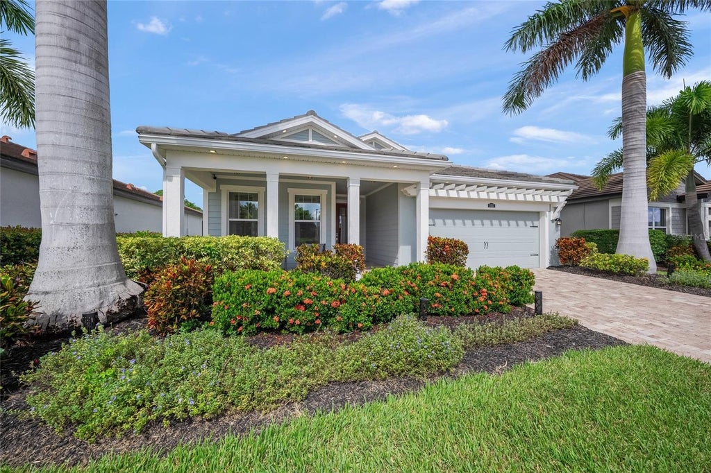 Photo of 5557 Long Shore Loop, Sarasota, FL 34238 (MLS # A4705753)