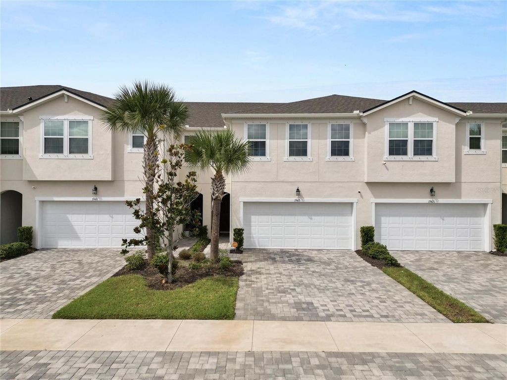 Photo of 19415 Monarch Wind Way, Lutz, FL 33558 (MLS # A4666823)