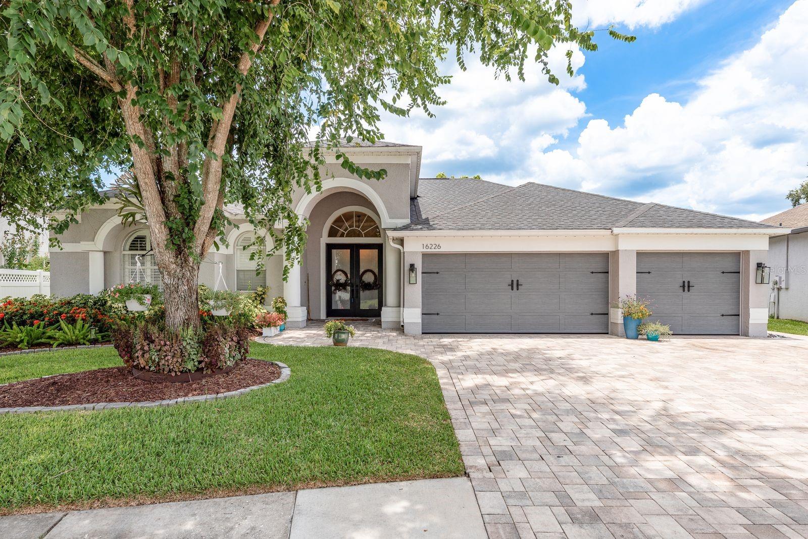 PRICE REDUCED $25,000!!!...Experience refined Florida living at its finest in this impeccably upgraded residence in the guard-gated, golf course community of The Eagles. Positioned along the 15th hole of the Lakes Course, this 4-bedroom, 3-bath, 3-car garage home offers sweeping pond and fairway views with no rear neighbors—an exceptional blend of privacy, scenery, and sophistication.
Inside, you'll find soaring ceilings, custom crown molding, and remote-controlled blackout blinds that enhance the open, airy layout. New ceramic wood-look tile runs consistently throughout, offering durability with designer appeal. The reimagined kitchen stuns with quartz countertops, custom cabinetry, a smart refrigerator, and an oversized double-tiered island ideal for casual gatherings or refined entertaining.
All three bathrooms have been thoughtfully remodeled with upscale finishes. The expansive primary suite offers tray ceilings, direct pool access, and a spa-like en-suite with dual vanities, a soaking tub, and a separate walk-in shower.
Outdoors, the lifestyle continues with a panoramic screened lanai showcasing a resurfaced heated saltwater pool and spa. The extended paver patio with a built-in gas firepit and grill area overlooks tranquil water and golf course views beneath mature trees—perfect for unforgettable evenings year-round.
Additional updates include a five-year-old roof, newer A/C system (2018), new insulated garage doors, a 2023 water softener, smart home controls, architectural Gemstone lighting, and remote-operated bedroom fans. The garage offers space for three vehicles plus golf cart parking.
Community amenities include two championship golf courses, a clubhouse, tennis courts, playgrounds, and walking paths—all within a secured, patrolled environment.
This property’s location is unmatched. Situated just moments from schools, shopping, dining, and medical facilities, it’s also a short drive to Gulf Coast beaches and only 30 minutes from Tampa International Airport. Whether you’re seeking a peaceful retreat, a winter haven, or a family-friendly residence, this home offers the perfect balance of tranquility and convenience.
Luxury, location, and lifestyle converge here. Schedule your private showing today.