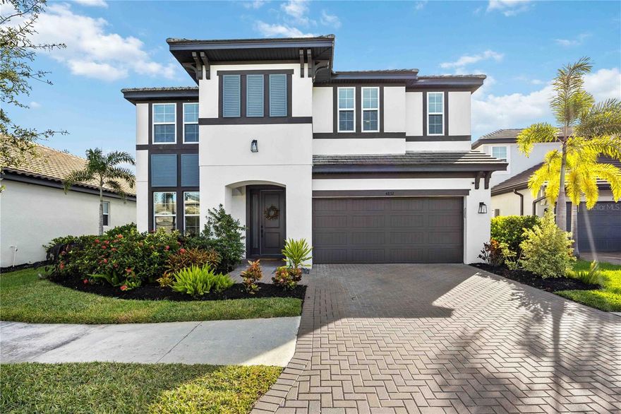 A rare find in the coveted gated community of Worthington! This beautifully refined 5-bedroom, 4-bathroom POOL home offers over 3,800 SQ FT of elegant living — designed for those who value luxury, comfort, and effortless style.
Built in 2020, this home combines the freshness of newer construction with the comfort and refinement of a residence that’s been beautifully settled and enhanced — truly better than new.
From the moment you arrive, the curb appeal stands out with paver driveways, a tile roof, and lush landscaping that set the tone for what’s inside. Step through the front door and into a bright, open living space where natural light highlights luxury laminate flooring, quartz countertops, and crown molding. Every detail reflects thoughtful design and meticulous care.
Designed for those who love to cook and connect, the gourmet kitchen flows beautifully into the expansive great room, offering both sophistication and warmth. Outfitted with a gas cooktop, convection wall oven, stainless steel appliances, and an oversized island, it’s perfect for gatherings large or small. A thoughtful prep area adjacent to the walk-in pantry elevates everyday convenience and culinary creativity.
Upstairs, a spacious loft offers endless possibilities — perfect as a second living room, game room, home theater, or versatile flex space. Whether hosting movie nights, creating a quiet reading retreat, or designing the ultimate play area, this bonus space enhances the home’s already impressive functionality.
Luxury living continues throughout the home’s dual primary suites, each offering its own private sanctuary with spa-inspired ensuite baths featuring dual vanities, glass-enclosed showers, and generous walk-in closets. This flexible layout is ideal for multi-generational living or providing guests with a retreat of their own.
Step outside to your private backyard oasis, where a sparkling pool and screened-in lanai create the perfect setting for al fresco dining, lounging, and entertaining year-round — all surrounded by peaceful, manicured greenery.
With HVAC UV lights enhancing air quality and system performance, this home offers not just luxury but also healthier, smarter living.
Located east of I-75, you’ll enjoy the tranquility of a quiet, gated community while staying close to everything Sarasota offers — UTC shopping and dining, downtown culture, world-class golf, and the area’s famous Gulf beaches, all within minutes.
Luxury. Comfort. Lifestyle. It all comes together here — in a home that feels fresh, refined, and ready to welcome you home.
Schedule your private tour today and experience the best of Sarasota living in Worthington.