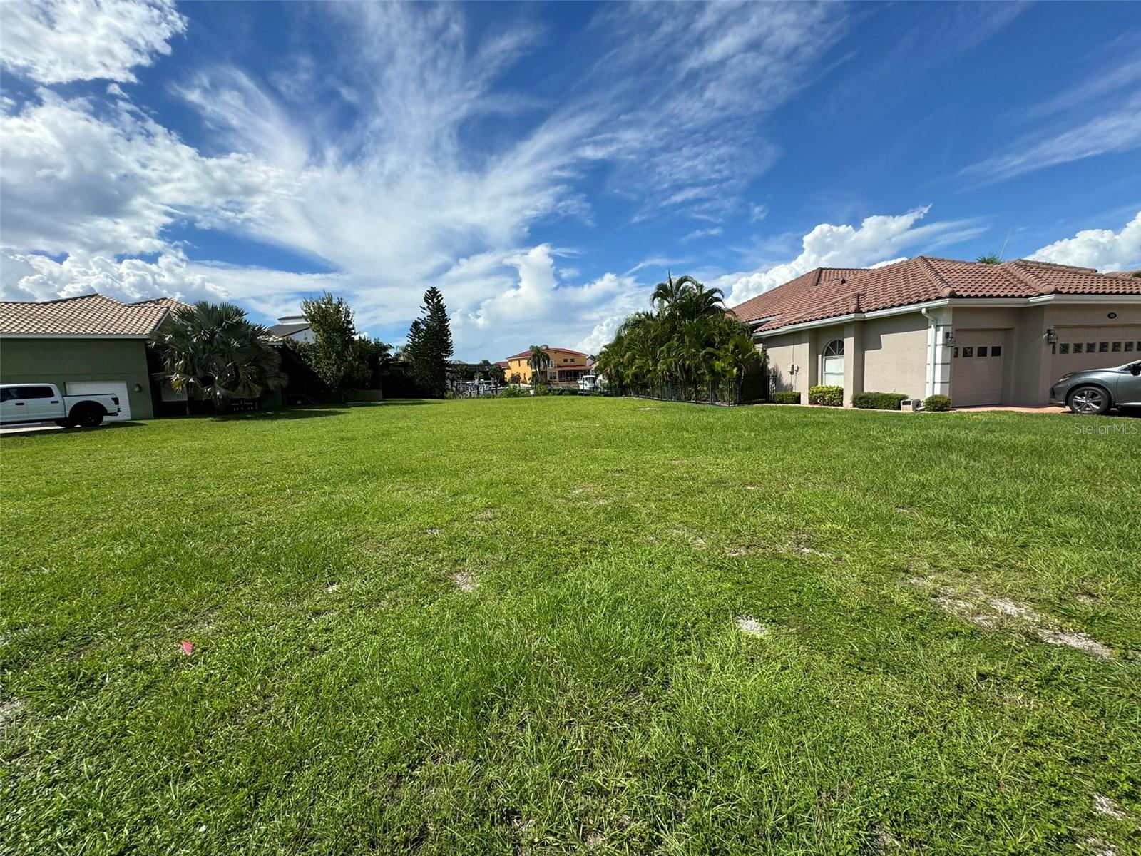Build your custom home today. No CDD, gated, guarded community, with low annual HOA. A beautiful waterfront lot with plenty of frontage to build your dream home. Located in coveted Symphony Isles. This lot has direct access to the gulf and is minutes to Tampa Bay. This gated community features a 24 hour fully staffed gate. Symphony Isles offers waterfront homes along with unprecedented access to the bay. In the heart of Apollo Beach close to I-75 and all the area attractions. Don't miss this opportunity to build your waterfront dream home.