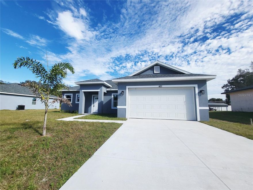 BUYER INCENTIVES AVAILABLE!
Step into a home that makes the transition to Florida feel effortless. This recently constructed residence offers a modern, open-concept layout that seamlessly connects the living, dining, and kitchen areas—creating a bright, airy space designed for both everyday living and entertaining.
Large-format ceramic tile flooring extends throughout the main areas, providing a clean, low-maintenance lifestyle—ideal for those looking to simplify without compromising on style. The kitchen is both functional and inviting, featuring solid surface countertops, contemporary cabinetry, a spacious center island, and pendant lighting that adds a warm, modern touch.
Bathrooms are thoughtfully finished with floor-to-ceiling tiled showers, offering a sleek, updated feel throughout the home.
The flexible layout allows for a variety of uses, including a home office, additional living space, or guest accommodations—adapting easily to your needs. Sliding glass doors open to a spacious backyard, creating a natural extension of the living space and offering privacy and room to enjoy the outdoors.
The property includes a garage and sits on a lot with no HOA, providing added flexibility.
Conveniently located in a growing area of Palm Bay with easy access to Malabar Rd and I-95, and close to shopping, dining, and everyday essentials. Approximately 20 minutes to Melbourne beaches.
Move-in ready and easy to show.