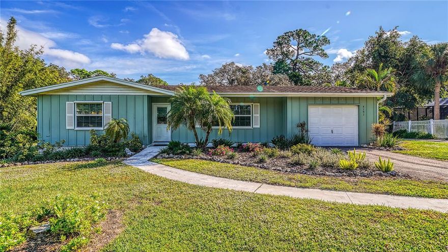 Rare opportunity to own a half acre of land and charming home in the desirable area of South Shade Ave! Hidden from the street, this peaceful property with beautiful mature trees holds a move-in ready 2 br/2ba home perfect for first time buyers and investors. Enjoy the privacy of this home or build your own dream home. Enter into a bright foyer with gleaming hardwood floors. Large windows allow beautiful natural light. A Fisher wood burning stove in the bonus room adds to the charm and provides warmth on chilly days. The large primary bedroom is spacious and comfortable. Picture yourself enjoying your morning coffee overlooking the peaceful scenery from the large back porch. Located near beaches, shopping, restaurants  and downtown Sarasota, this property has it all! You do not want to miss the opportunity to own this unique home and property.