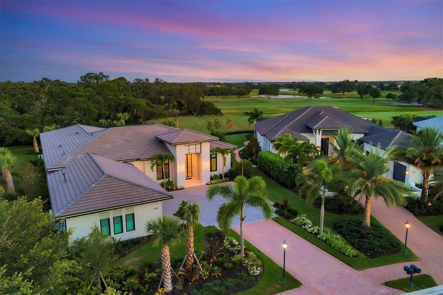 Welcome to a masterpiece nestled within the private gates of the coveted Founders Club.  Perfectly situated on a half acre homesite, this brand new, never lived in, London Bay home was just completed and no expense was spared.  Boasting sights of the golf course fairway and private nature preserve, enjoy 800 yards of unobstructed golf course views encompassing the 10th, 13th and 14th holes.  Fashioned after London Bay’s Pembrook model, this home has been lovingly designed into a unique one of a kind, work of art.  As you enter, notice the upgraded additional two feet of ceiling height and the dramatic, sleek green veining marble by Porcelanosa adorning the Mooi fixture in the foyer.  The great room has retractable, disappearing impact glass sliders that open up to the 1305 square foot lanai.  The kitchen island was enlarged to accommodate two dishwashers and a trash compactor.  The stainless Wolf appliances include a panel ready subzero refrigerator custom built and integrated to match the cabinetry.  There is a practically situated built in wine fridge and a dedicated water line for the Keurig coffee system.  The cabinetry was extended on both sides adding two pull out pantries.  Silestone polished countertops adorn the kitchen.  The green veining marble is also used in the equally dramatic kitchen backsplash.  All spaces have high end ceiling fans, architectural ceiling details and light fixtures by Kuzco.  Guests will love the gorgeous ensuite bedroom with custom walk-in closet.  Maybe they’ll want to squeeze in a workout in the adjacent fitness room!  Showcased on the other side of the home is the primary retreat with an enlarged master bath, custom built walk-in closets, oversized walk in shower, and two vanities with perfect lighting.  The office has a built in, customized desk with a dedicated fax/printer/scanner drawer.  The piece de resistance of this jewel however, is unerringly the outdoor space.  The outdoor area was enlarged to over 1305 square feet.  The panoramic screens allow for unobstructed 800+ yard views of the Robert Trent Jones Junior designed, 18 Hole Championship Golf Course.  Enjoy the private nature preserve with deer stopping by to greet you good morning.  The modern edge heated pool and spa are luxurious and spacious with multi colored ambient lighting.  The home has sophisticated, modern tile flooring throughout, impact glass, upgraded speakers and surround sound.  Located in the front of this half acre homesite is a serene lake, providing the ultimate privacy in the front as well as the back of the home.  Founders Club is a private, 24 hour guard gated community with only 262 residences amongst 700 acres of peaceful serenity.  Founders Club also offers tennis, basketball courts and a wonderful recreation center providing yoga and pilates classes.  With a 24,000 square foot, Savannah like designed clubhouse and only 225 equity golf members, the Founders Golf Club is highly sought after and exclusive.  If you can’t wait to join as a Golf Member, this home offers monetary and timing advantages with purchase.  Another perk of being a Golf Member is the fitness center which provides golf specific training classes.  This home is truly a must see.  It will will not disappoint in the slightest…. Even amongst the most discerning of buyers.