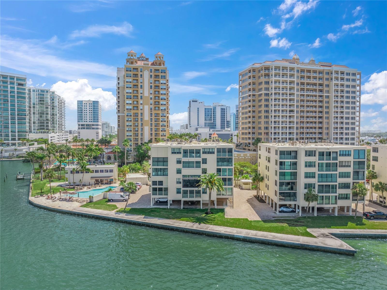 Welcome to Lawrence Pointe, a highly sought-after boutique community comprising of just three low-rise buildings. This community is positioned along the pristine Sarasota Bay and sits perfectly near vibrant downtown Sarasota. Inside, you will find a beautifully updated mid-rise condo that creates the perfect space for entertaining, gathering with friends and family, or displaying your collectibles and artwork. The spacious split floor plan offers tray ceilings, crown molding, and a very spacious master en-suite bedroom. This property offers the ideal balance of privacy and open living, while breathtaking sunsets provide a picture-perfect backdrop for your daily living. With two fully updated bathrooms, brand-new flooring in the bedrooms, and a gourmet kitchen featuring granite countertops and custom wood cabinetry with underlighting, every detail has been thoughtfully designed. Elevated to optimize its stunning vistas, the enclosed lanai which gives you an additional 160 sq. ft. of over all space is the perfect spot to unwind after a day of activities. Not to be overlooked is the prime proximity to the renowned St. Armands Circle and the pristine Lido Beach, making this location simply unbeatable. Start living the Sarasota dream today!
